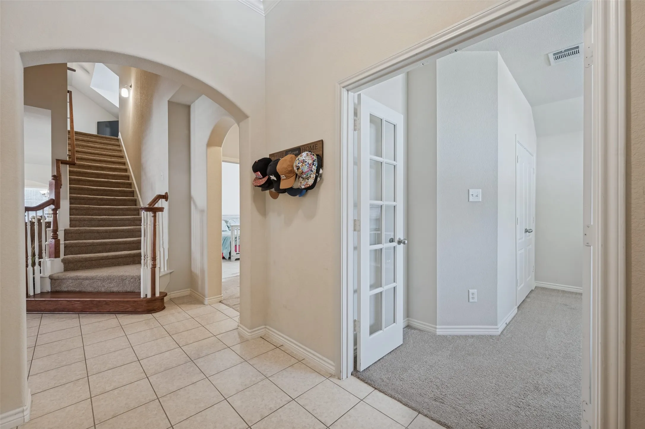 From garage entry, you have a front room bedroom, in this home it was used a playroom for the kiddo. along with secondary bedroom 2 and full bathroom
