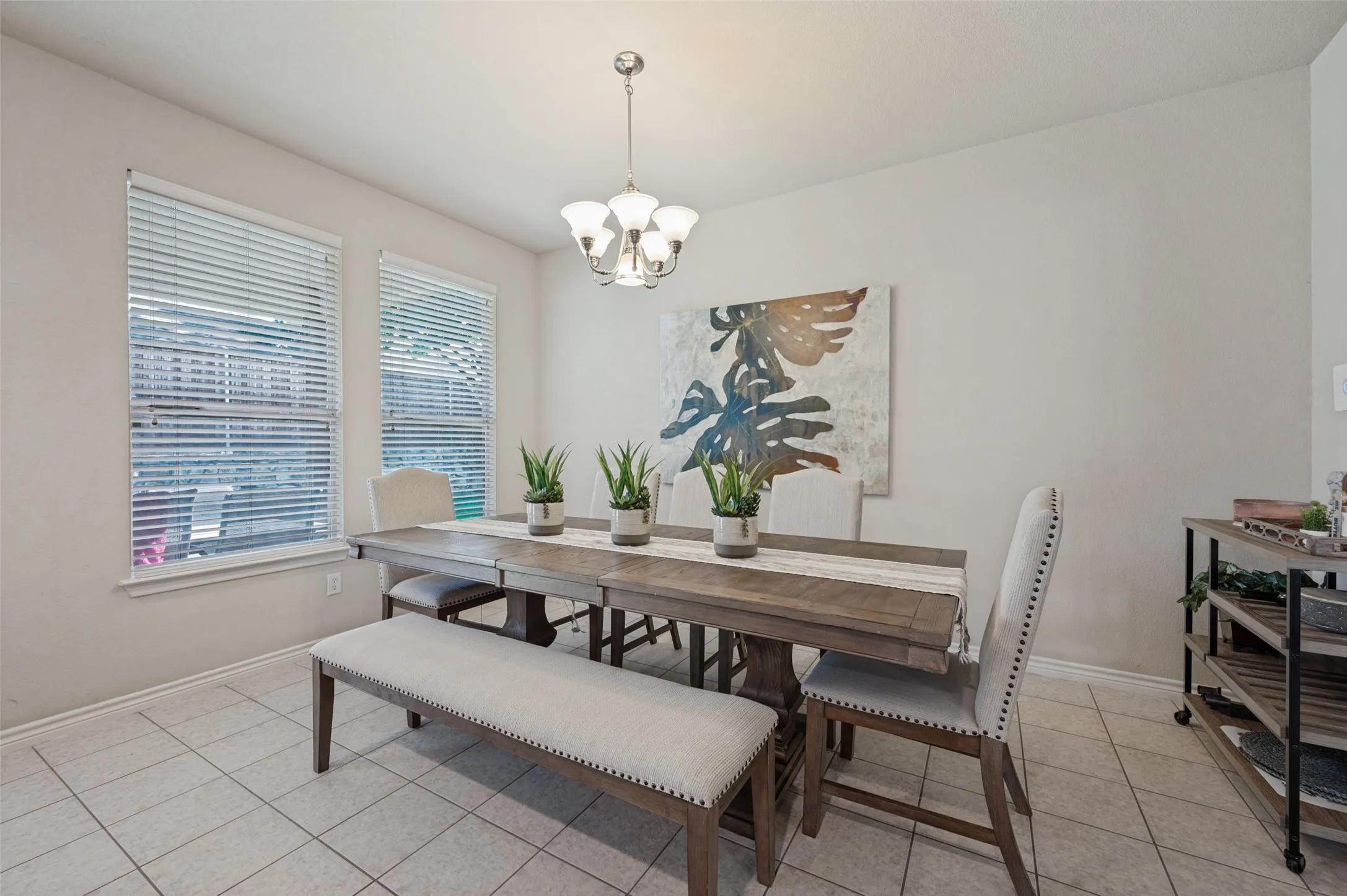 9 by 4 table , seats 8 and two bay windows that also look over yard.