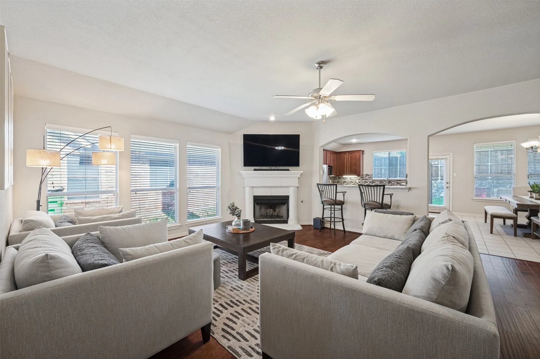 Large living space with ample space for big couches , direct sight into kitchen area and dine in area.
