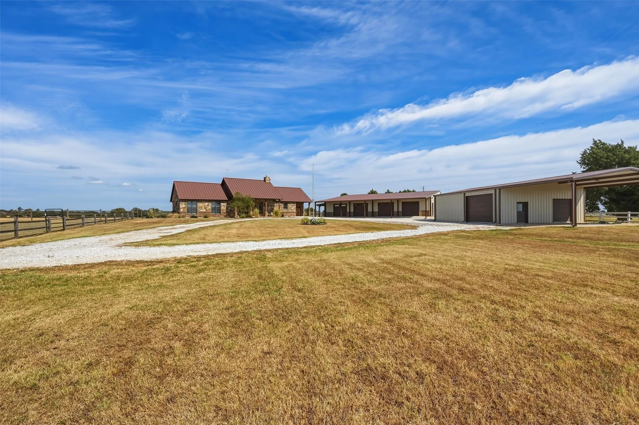 Front yard and outbuildings - including apartment and shop.