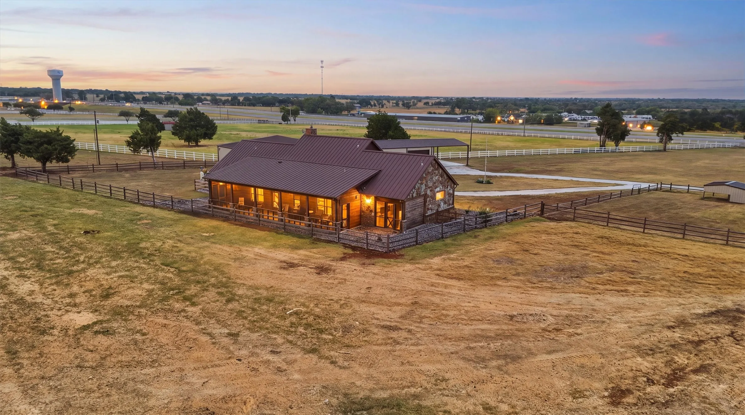 View of back of the custom, stone home.