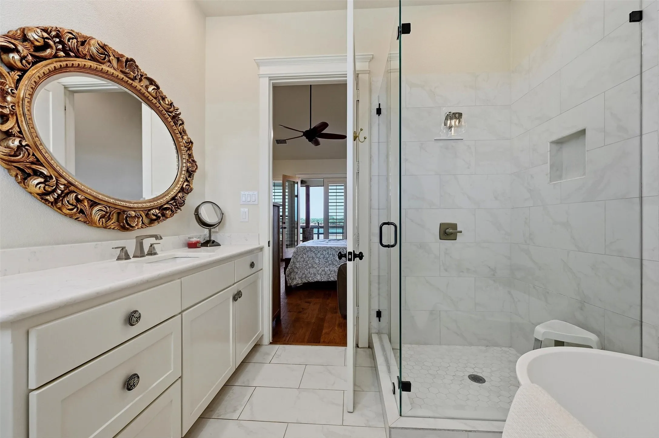 Primary bath with stand-alone shower and free standing tub.