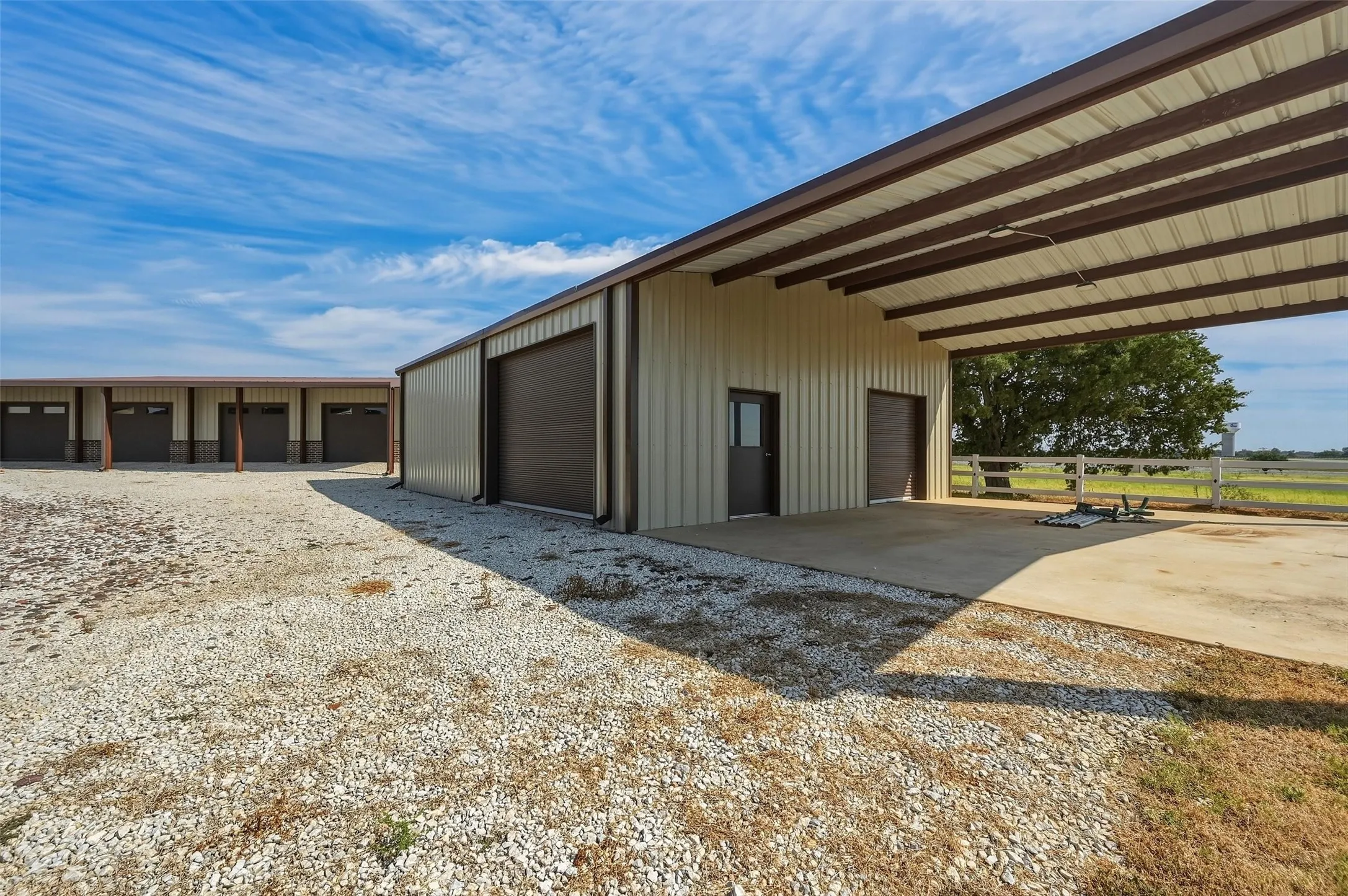 Garage/shop with covered parking.