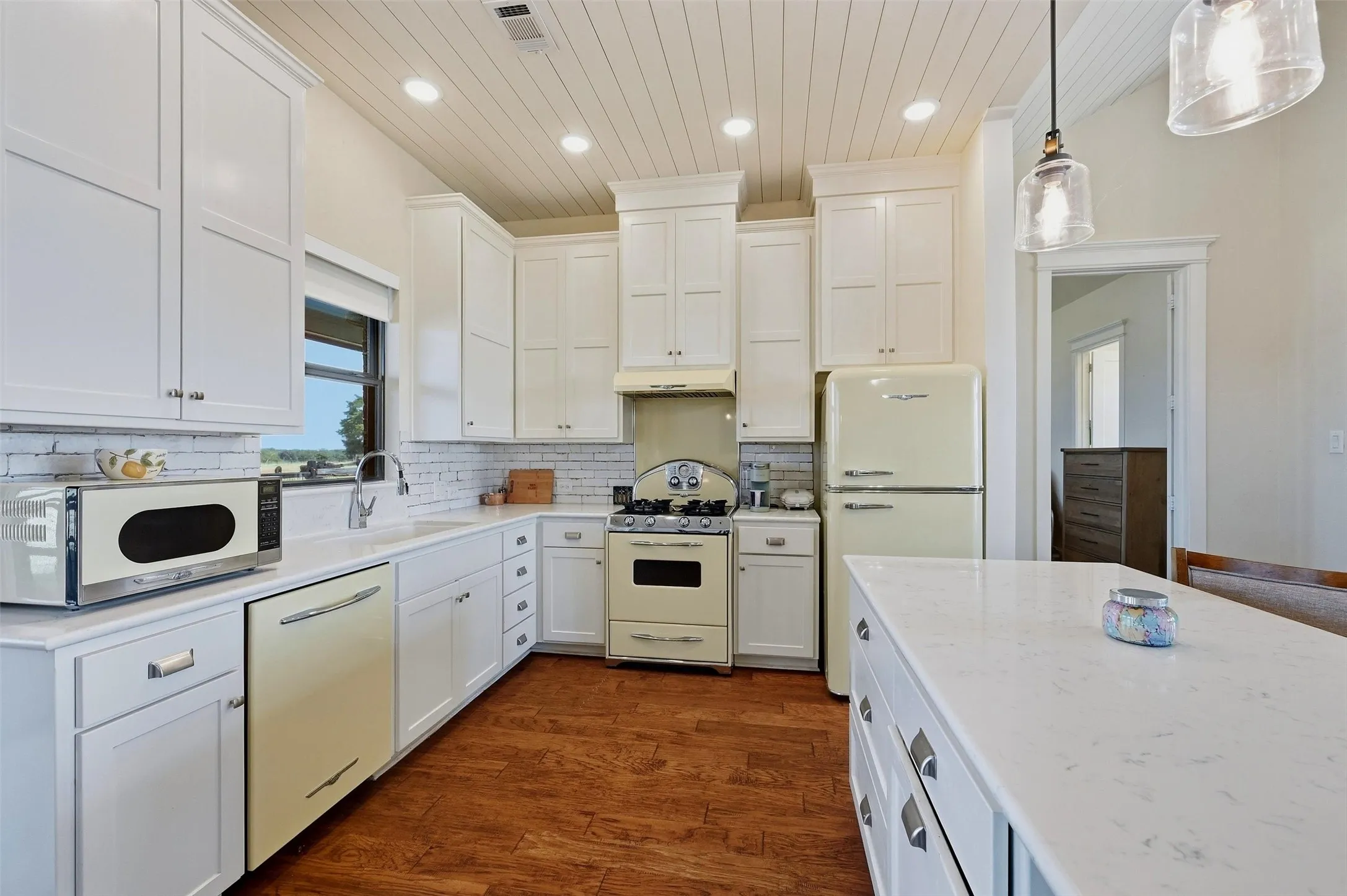 Kitchen with retro appliances and large island.