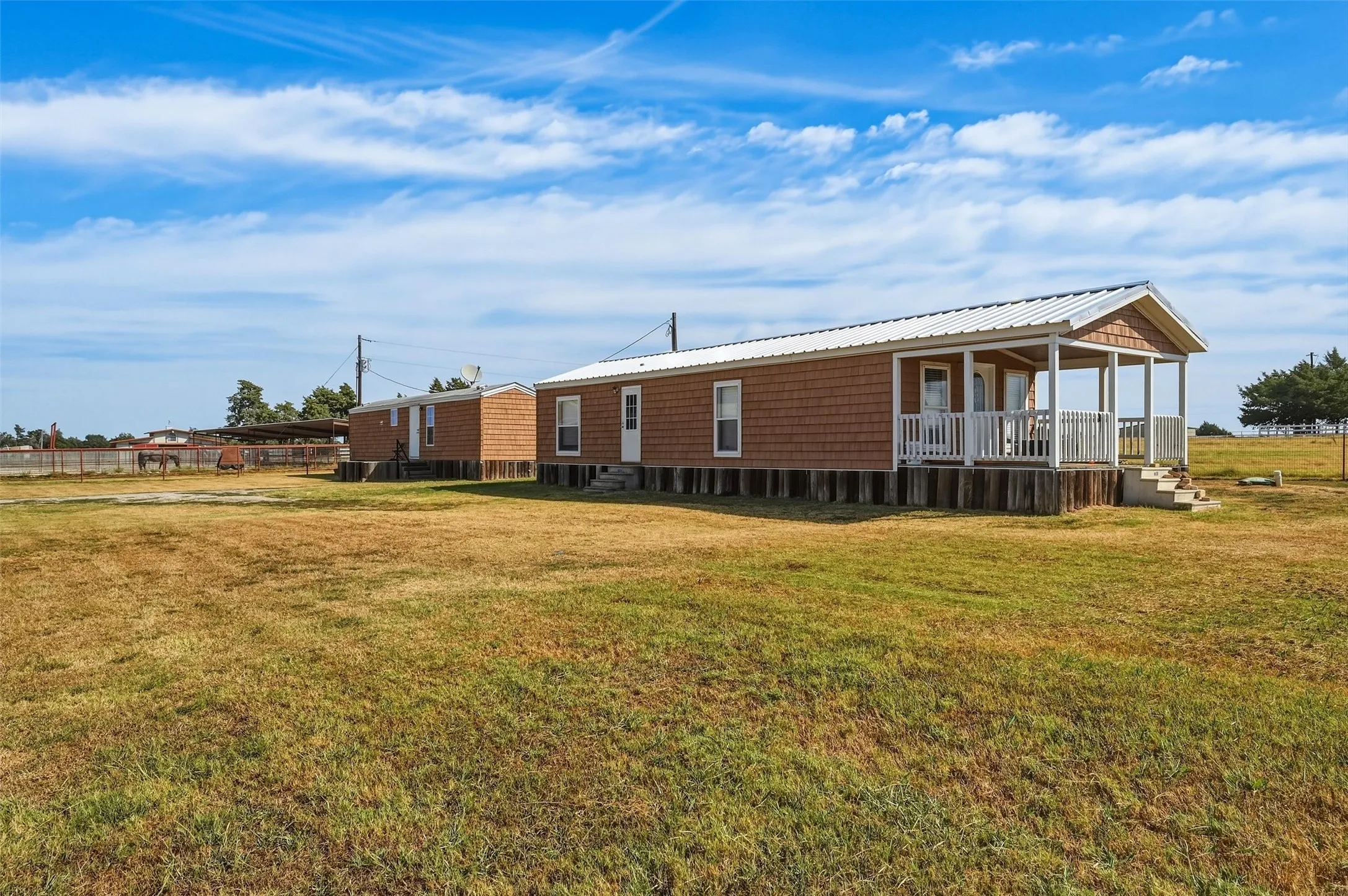 Two single-wide mobile homes adjacent to arena - great for staff or guests.