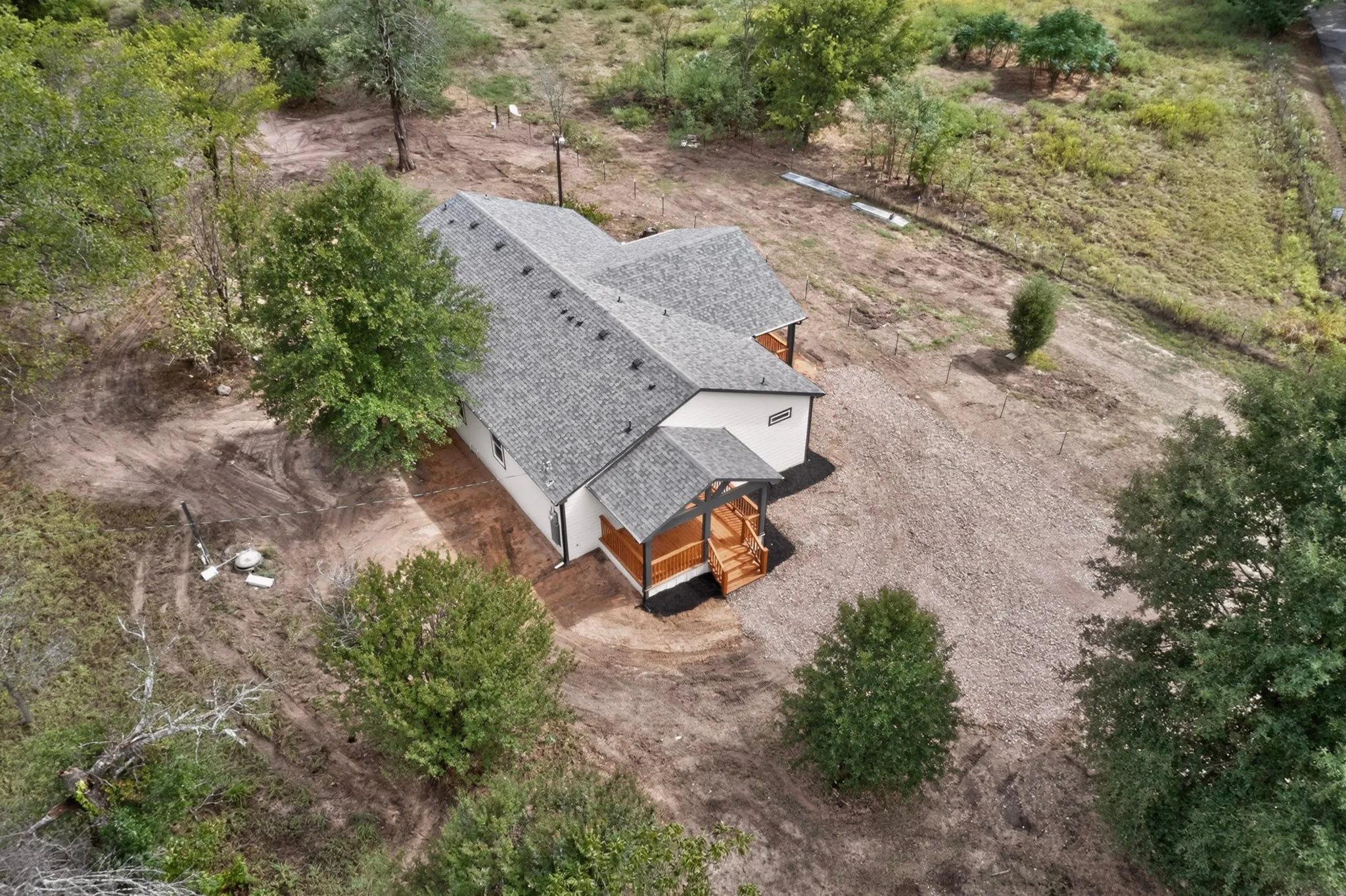 Pitched shingle roof with a light gray finish