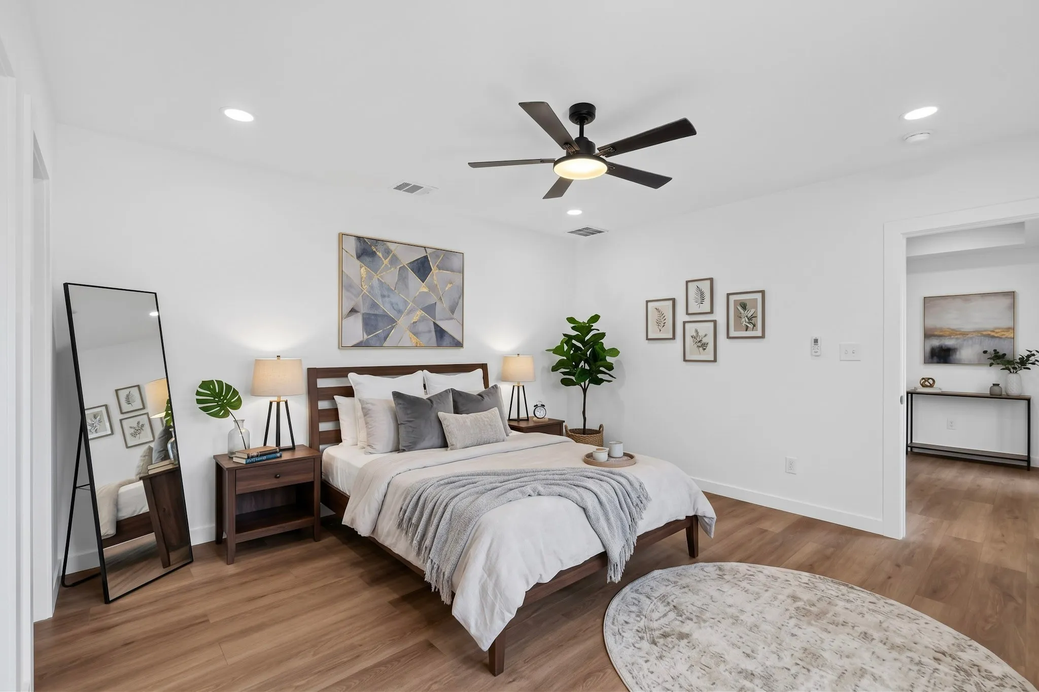 Recessed lighting, wood-finish flooring, ceiling fan, and white walls