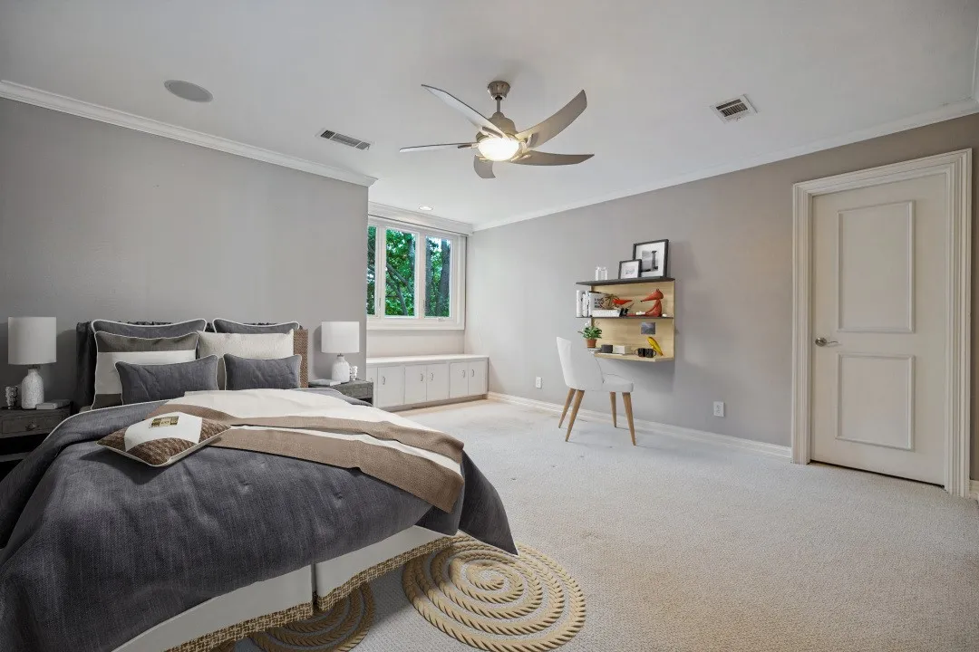 Recessed lighting, crown molding, ceiling fan with integrated lighting, built-in window seating with storage, and paneled interior door (this photo is virtually staged)