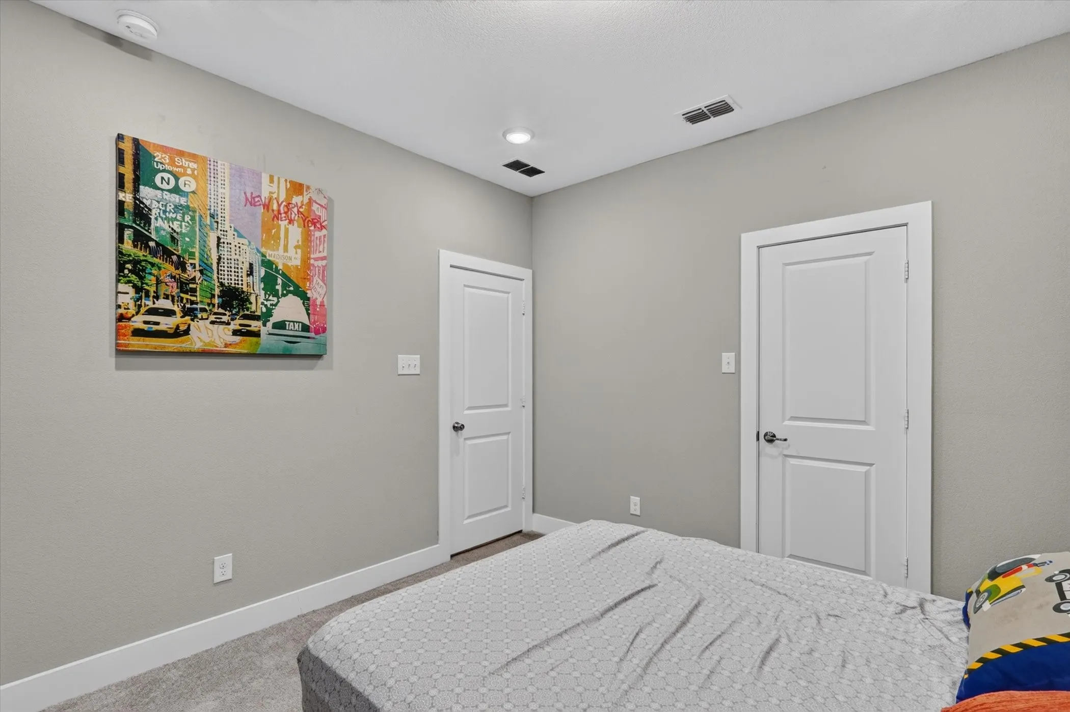 Recessed lighting, light gray wall finish, white trim, and white paneled doors