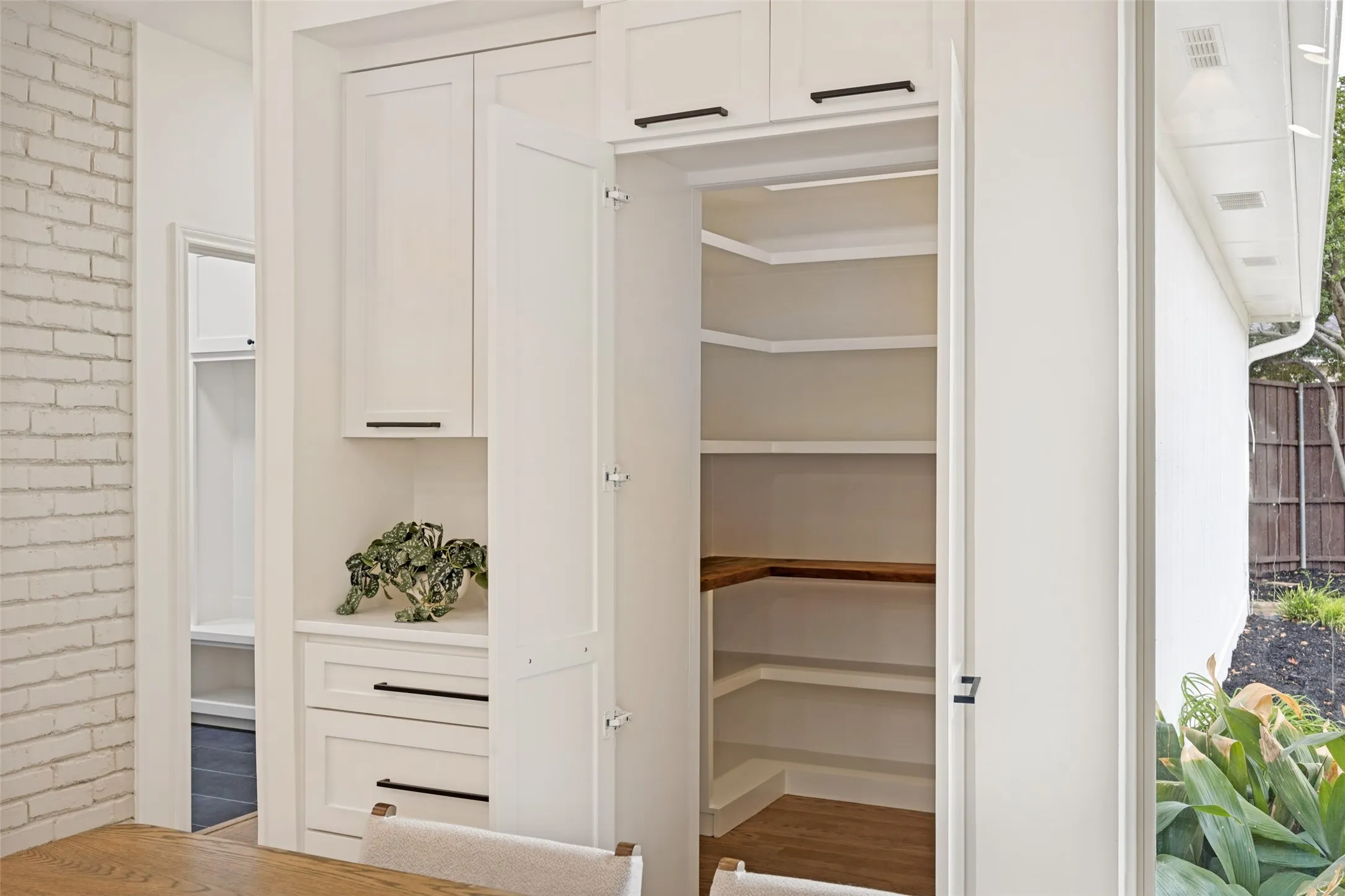 Breakfast area, notice opened hidden pantry door