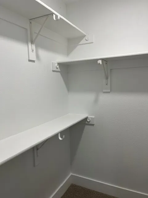 Built-in shelving with integrated hanging rods