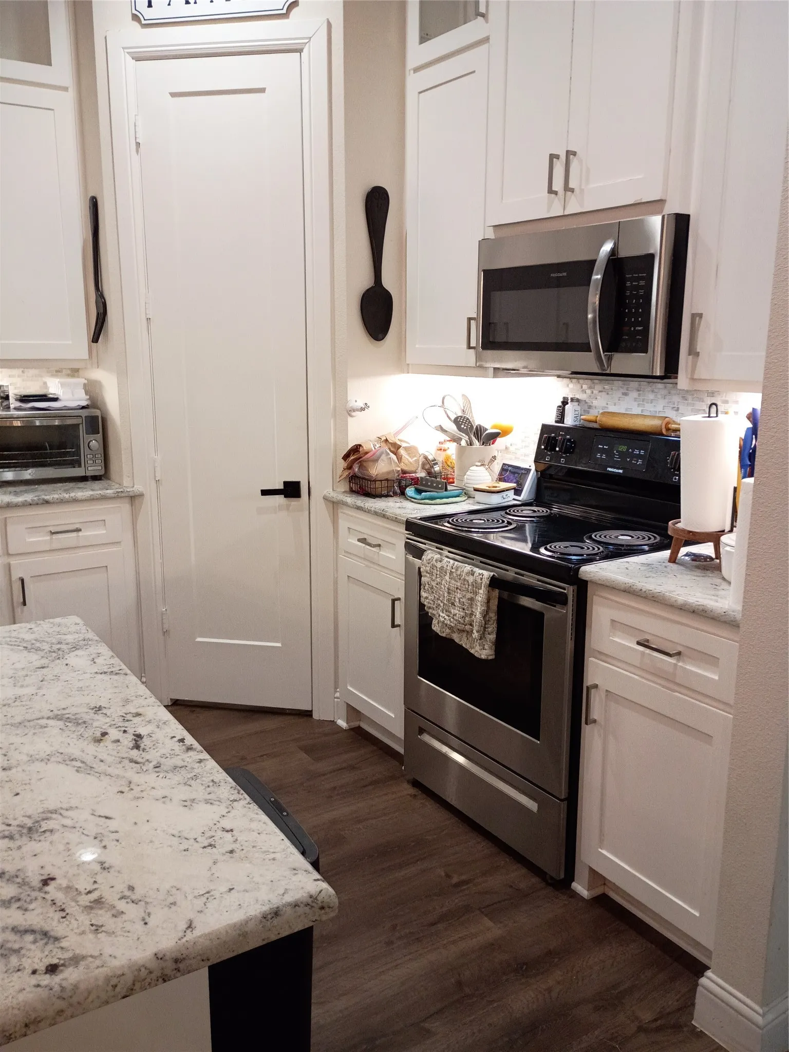 Quartz countertops, sleep modern stainless range and microwave