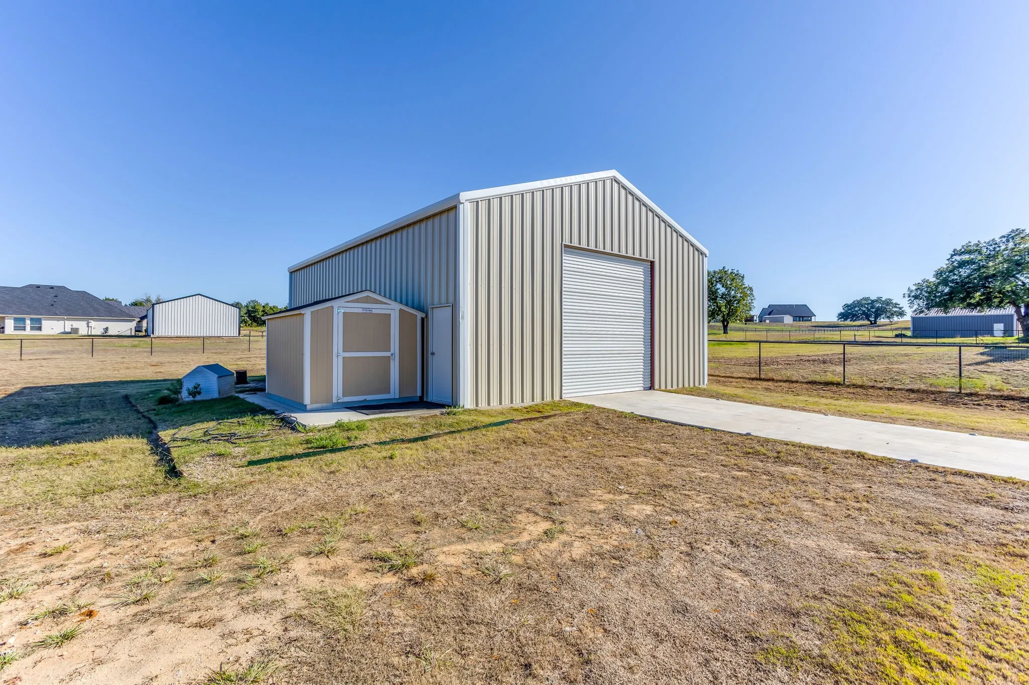 Workshop has overhead doors on both ends