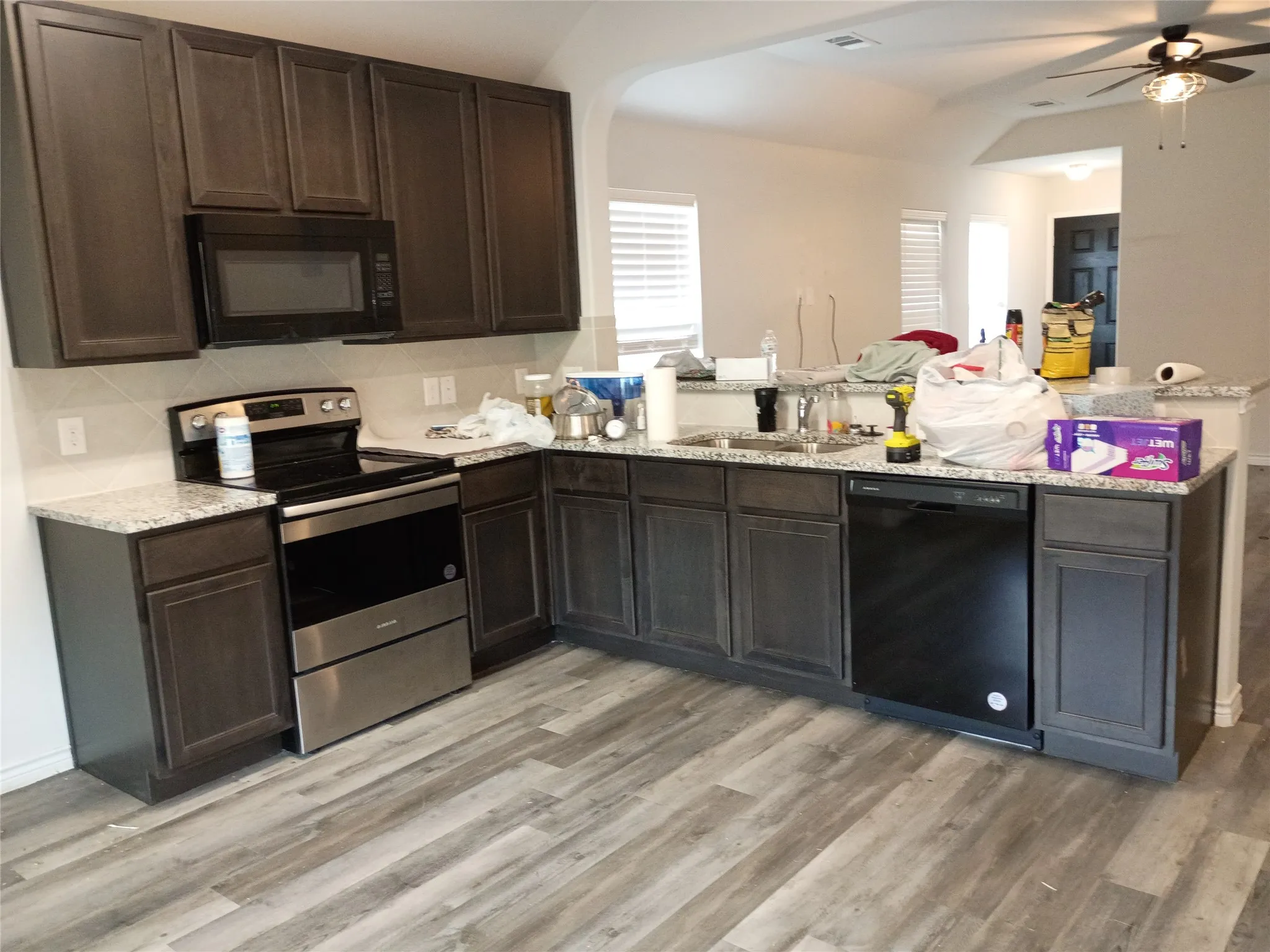 Lots of cabinets in spacious country kitchen. pantry to the left of the refrigerator space.& Microwave above oven