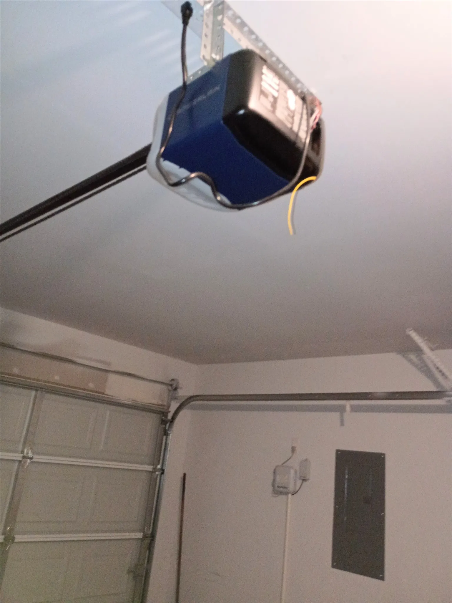 Two car garage has garage door opener