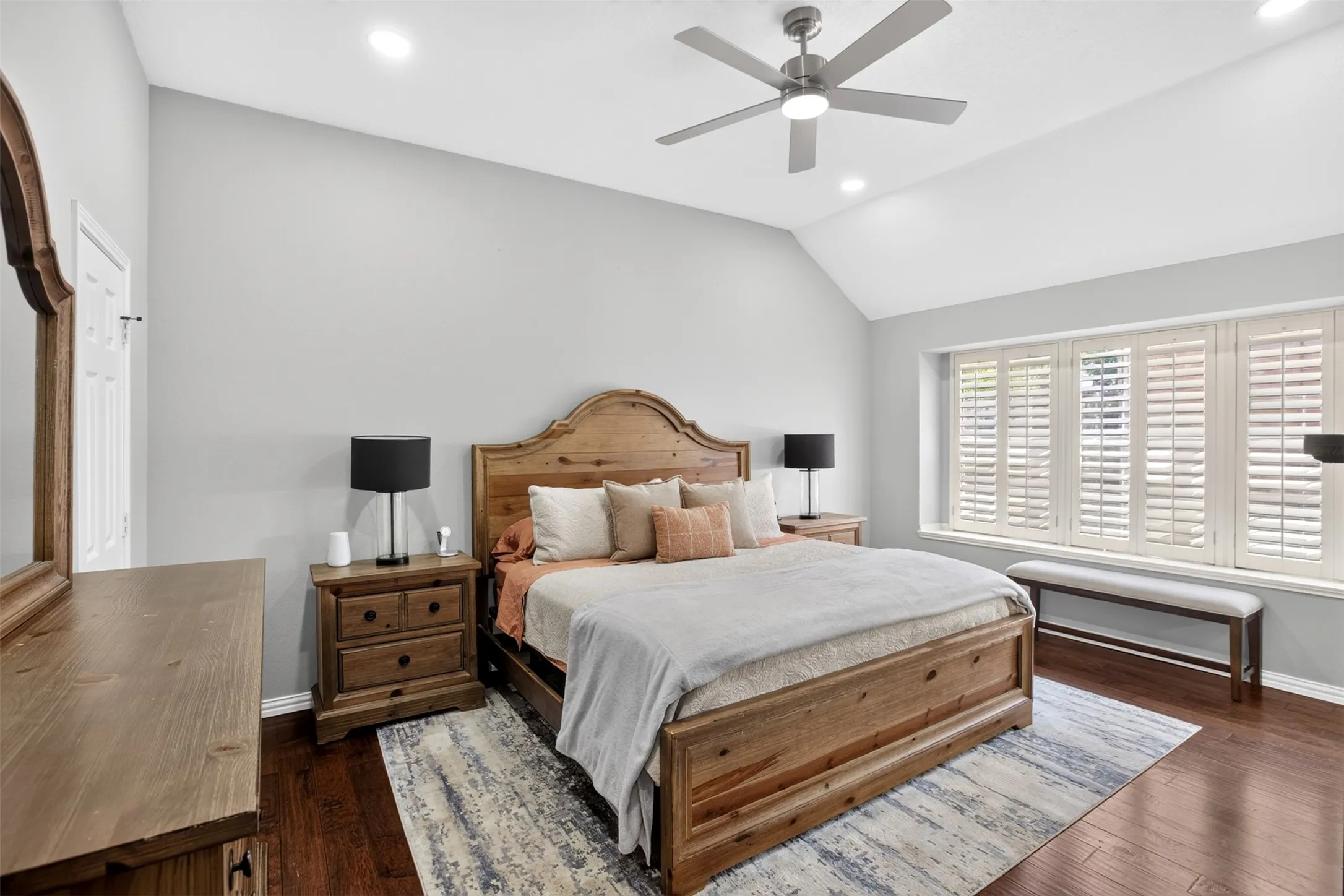 Vaulted ceiling, recessed lighting, ceiling fan, wood-finish flooring, plantation shutters