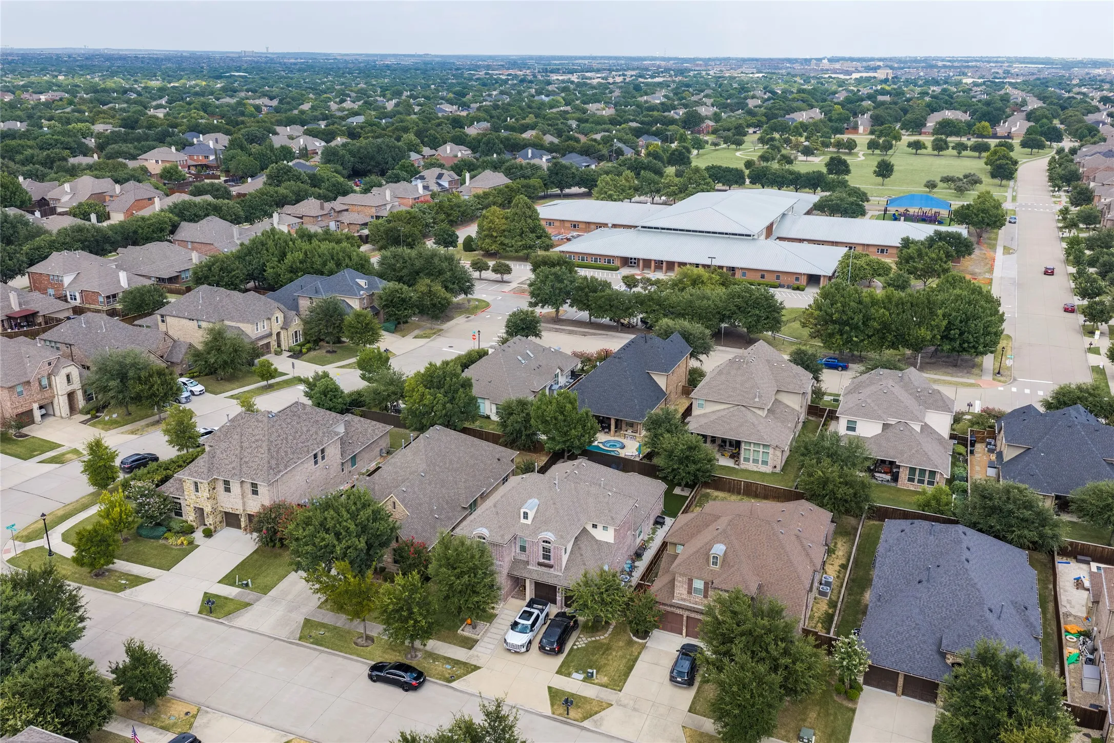 Aerial presentation of a residential neighborhood with mature trees