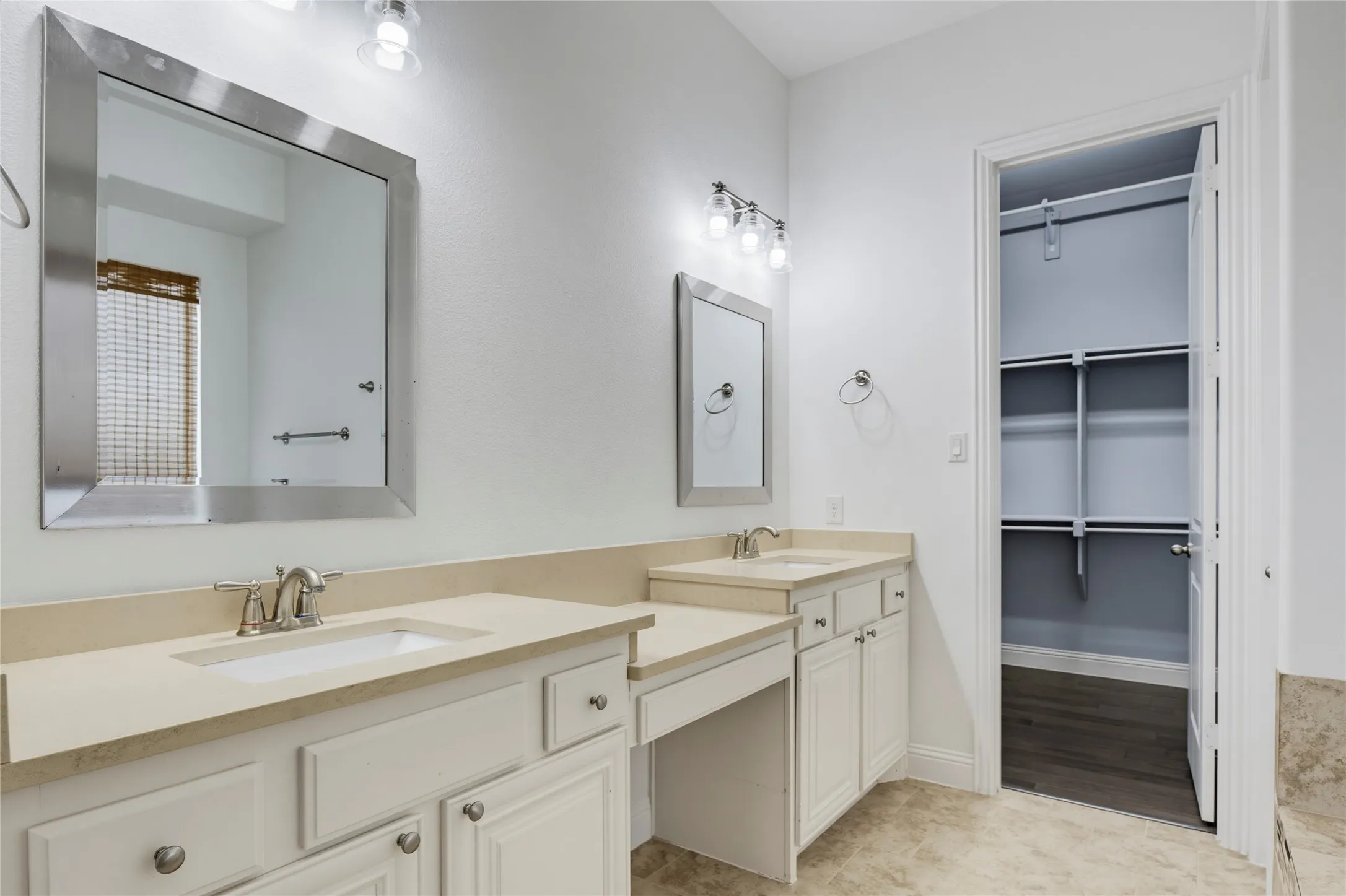 Dual vanities with integrated sinks and brushed nickel fixtures