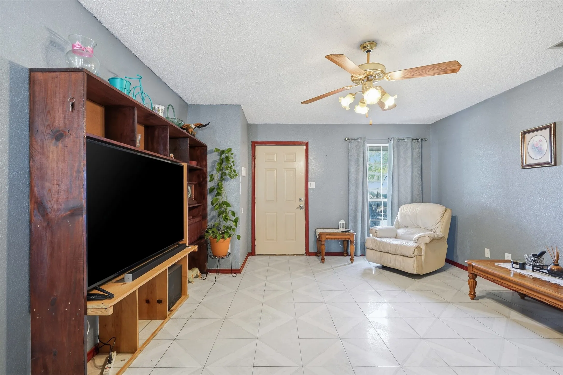Light gray walls complement the patterned floor tiling