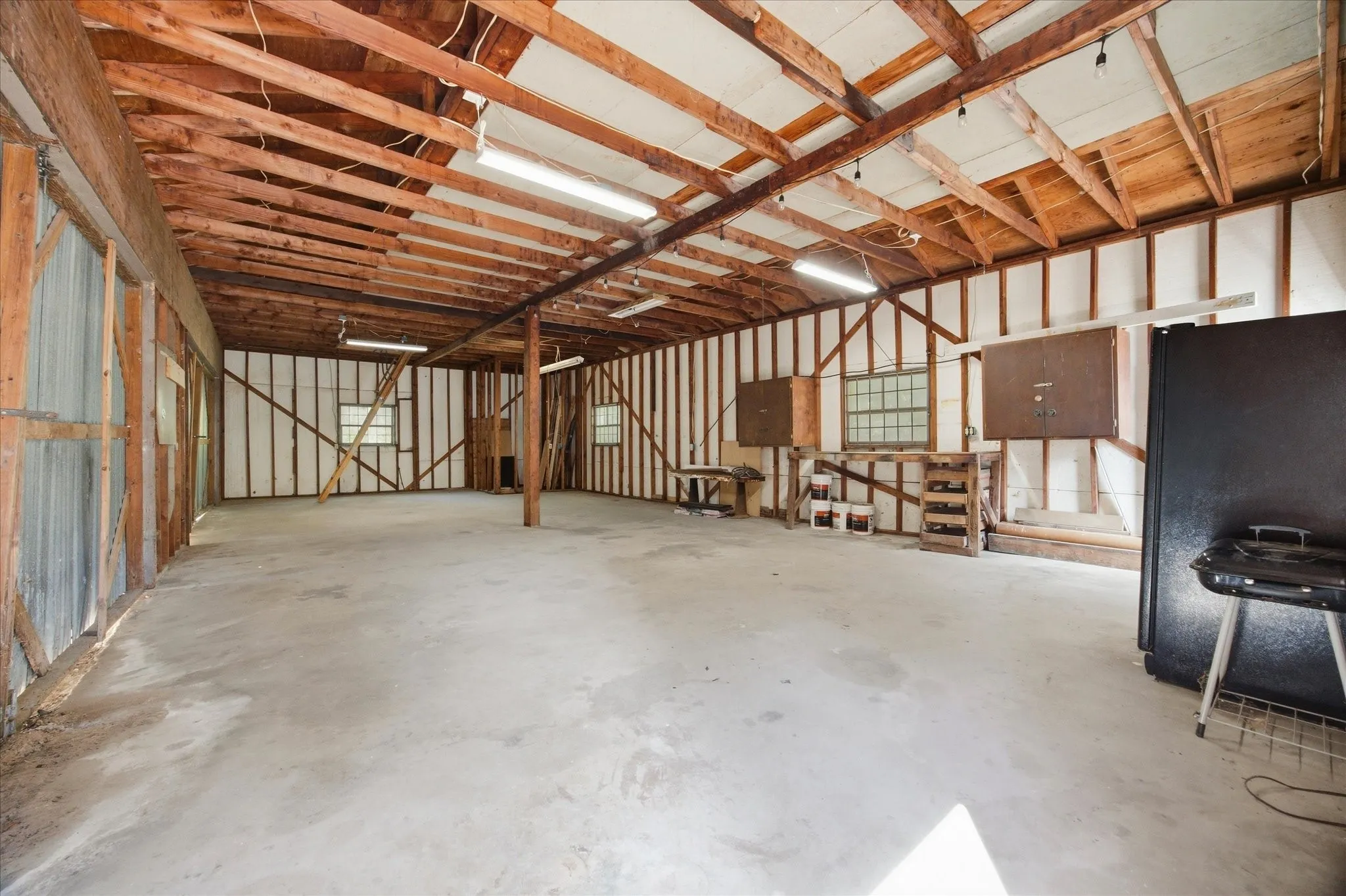 1145 SF workshop with loft storage and space for four vehicles.