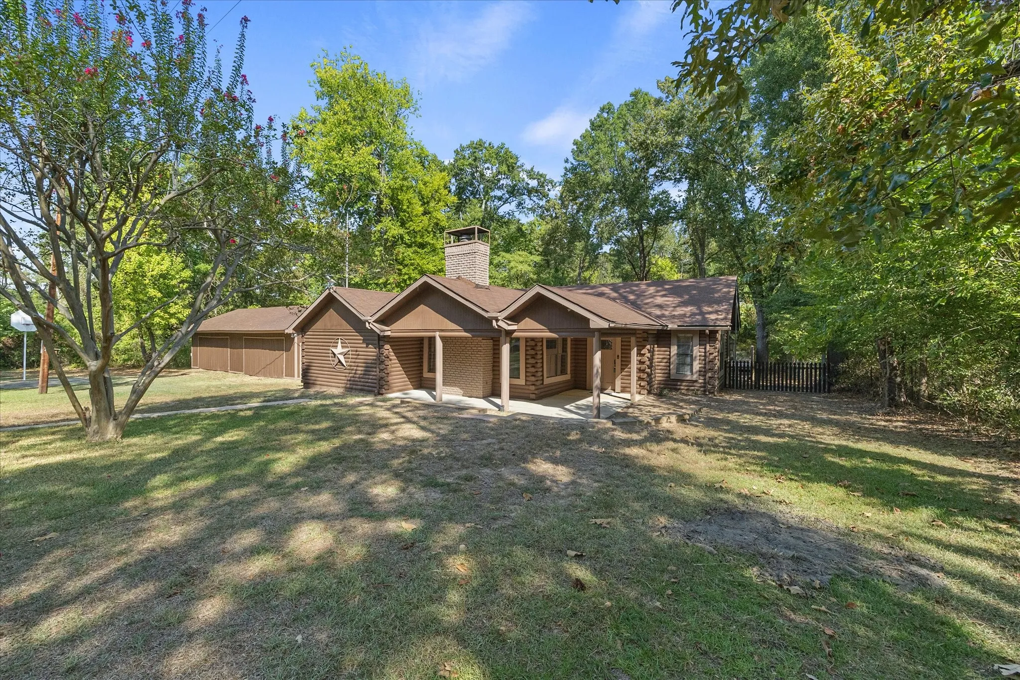 Come home to privacy and serenity! Charming 3/3 log home with four car garage/workshop, nestled on one acre wooded lot outside Edgewood city limits and just 10 minutes to Canton Trade Days.