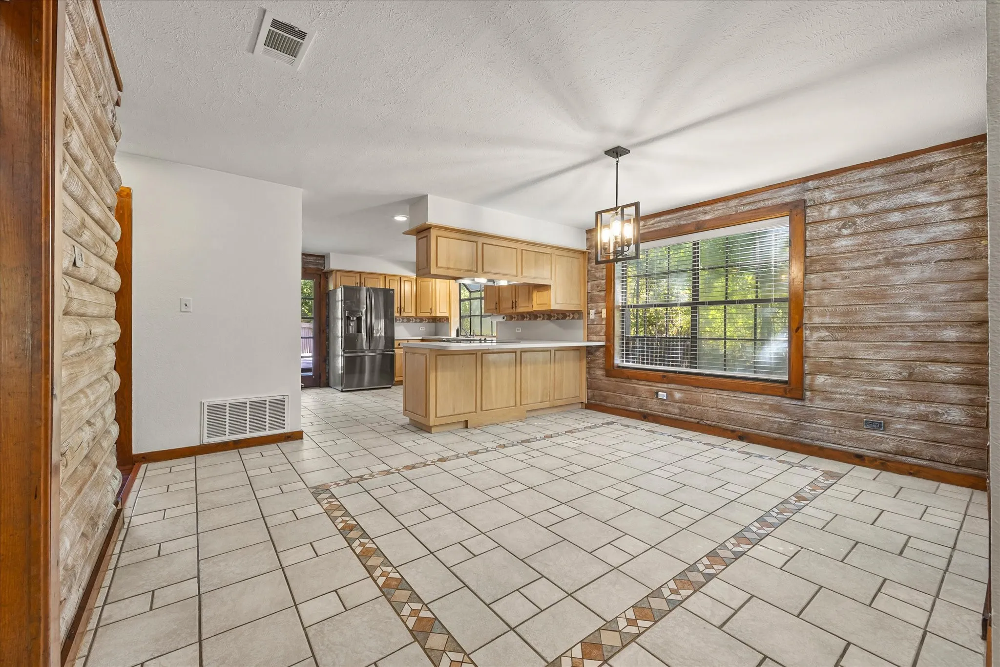 Ample dining room or second living area overlooking the kitchen and breakfast bar.