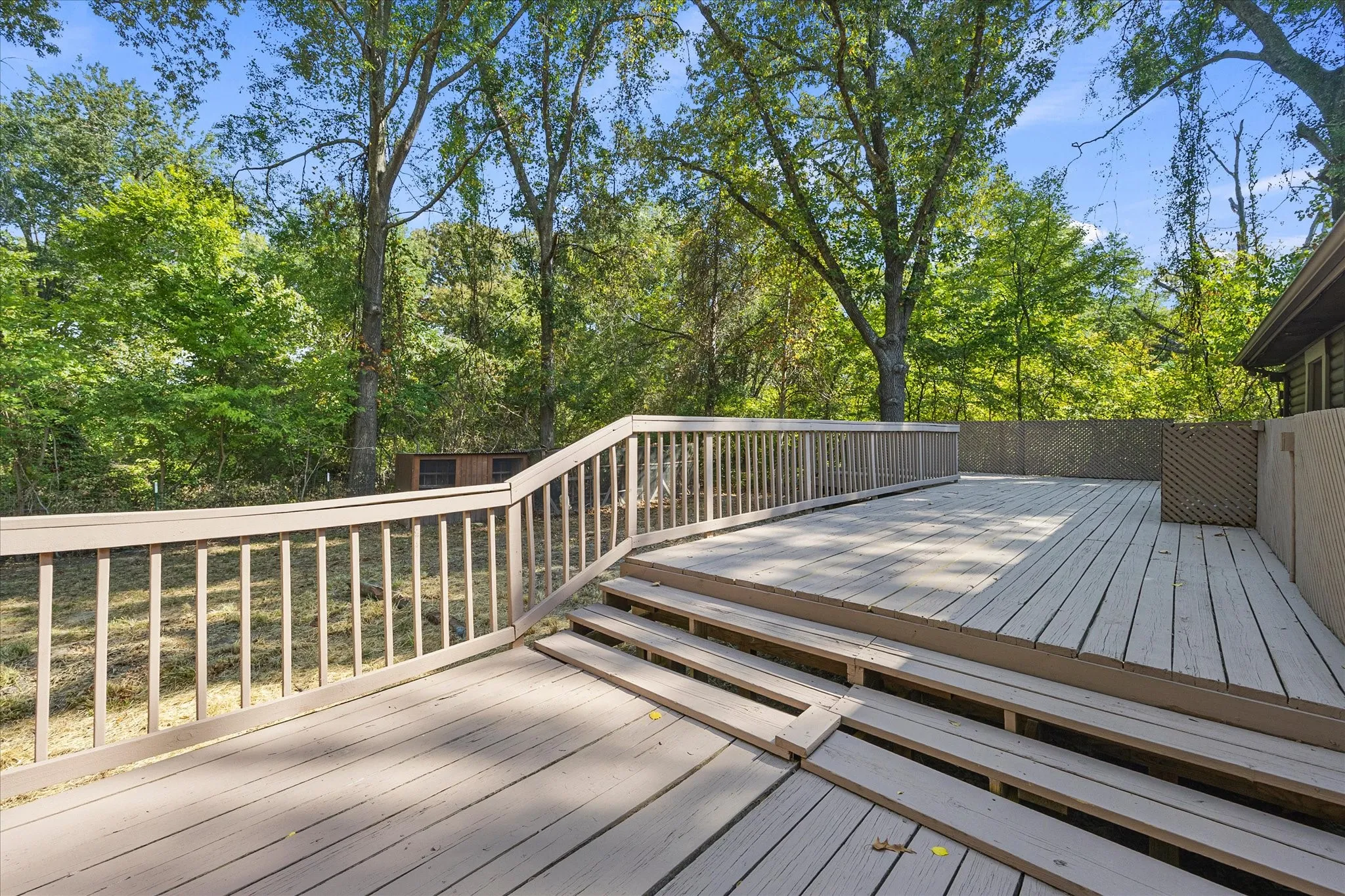 Expansive, multi-level wood deck on the back of the house.