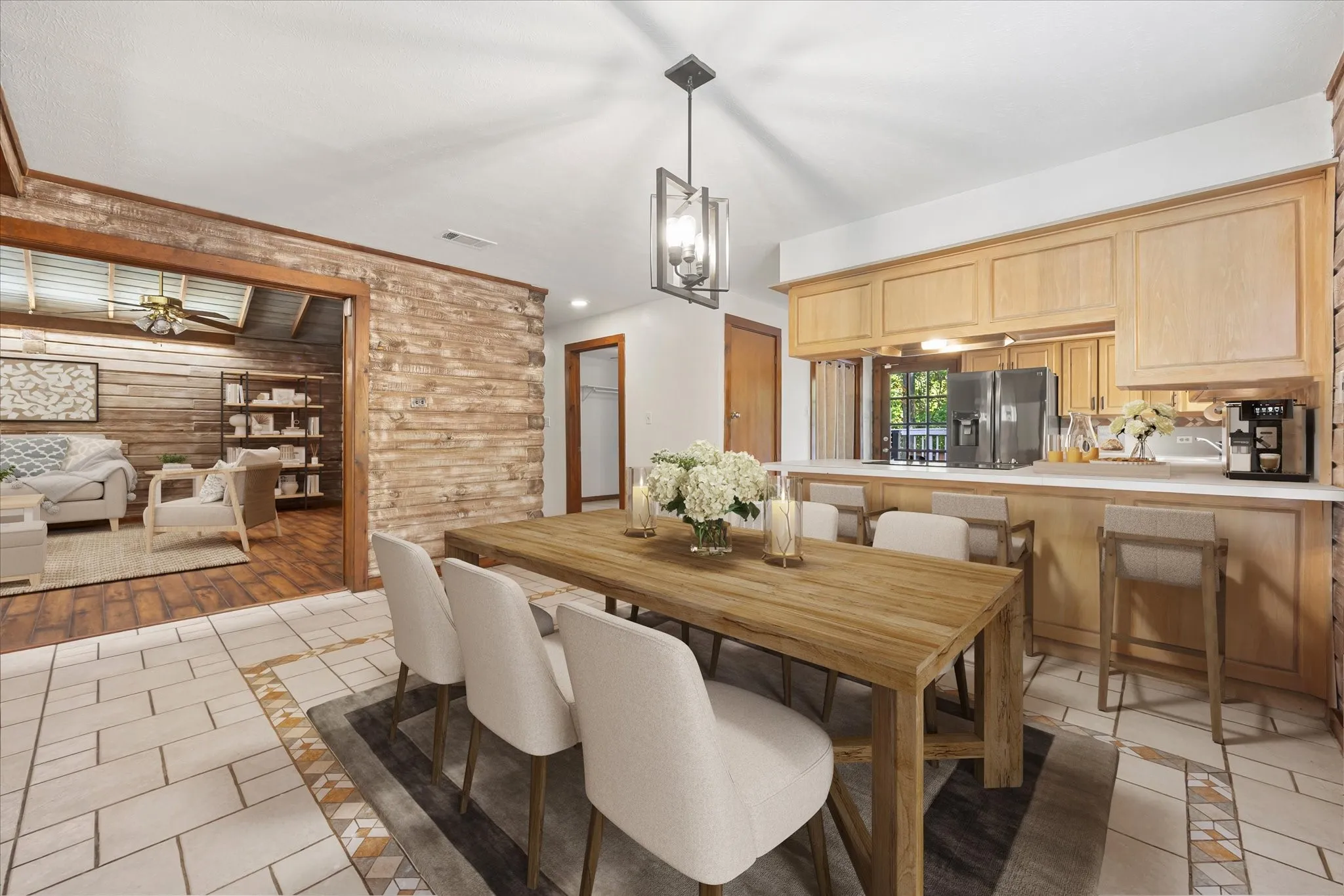 VIRTUALLY STAGED. Ample dining area overlooks the main living area and kitchen with breakfast bar.
