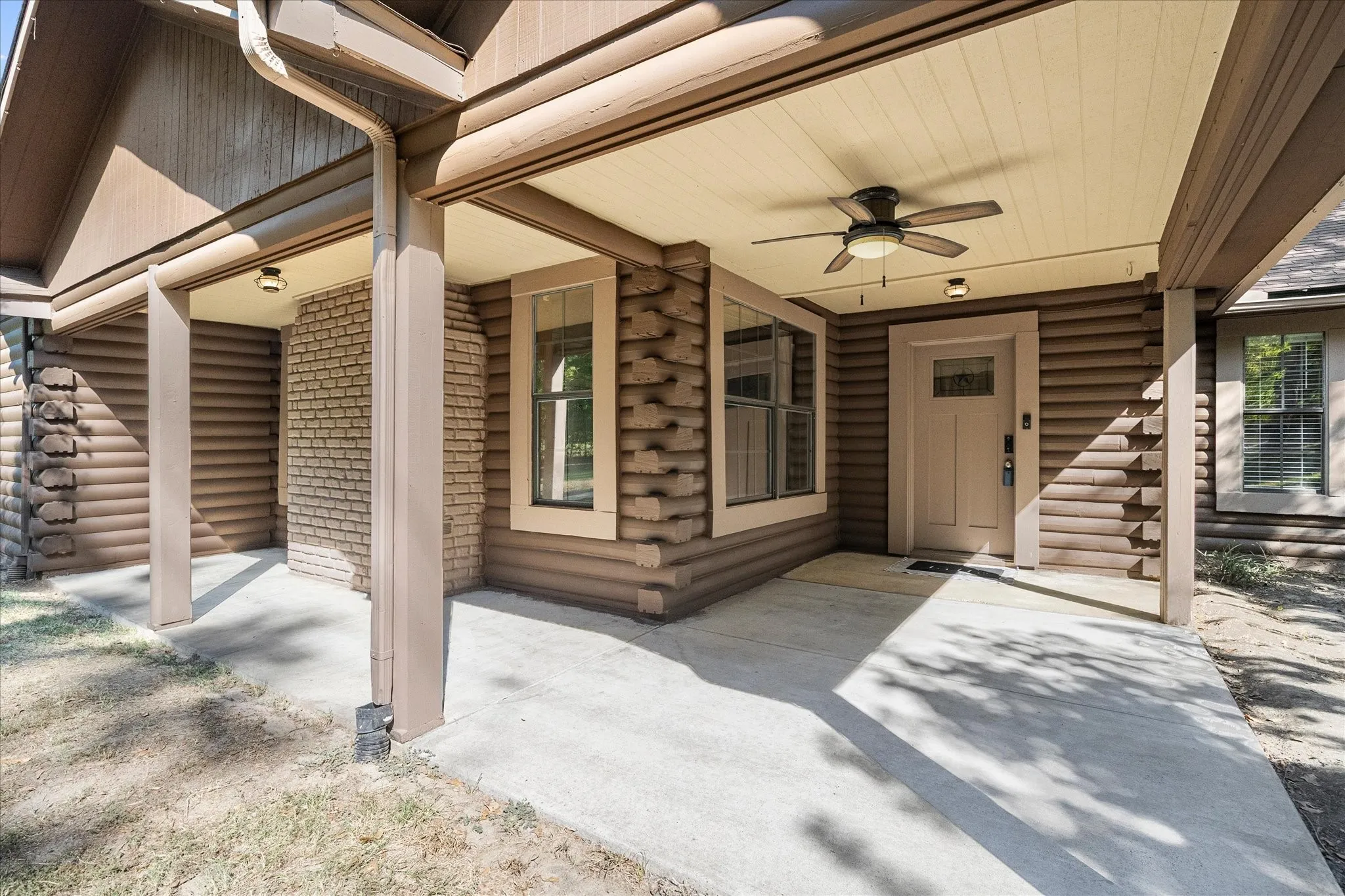 Expansive covered front patio - notice the detail in the woodwork. The quality of craftsmanship show!