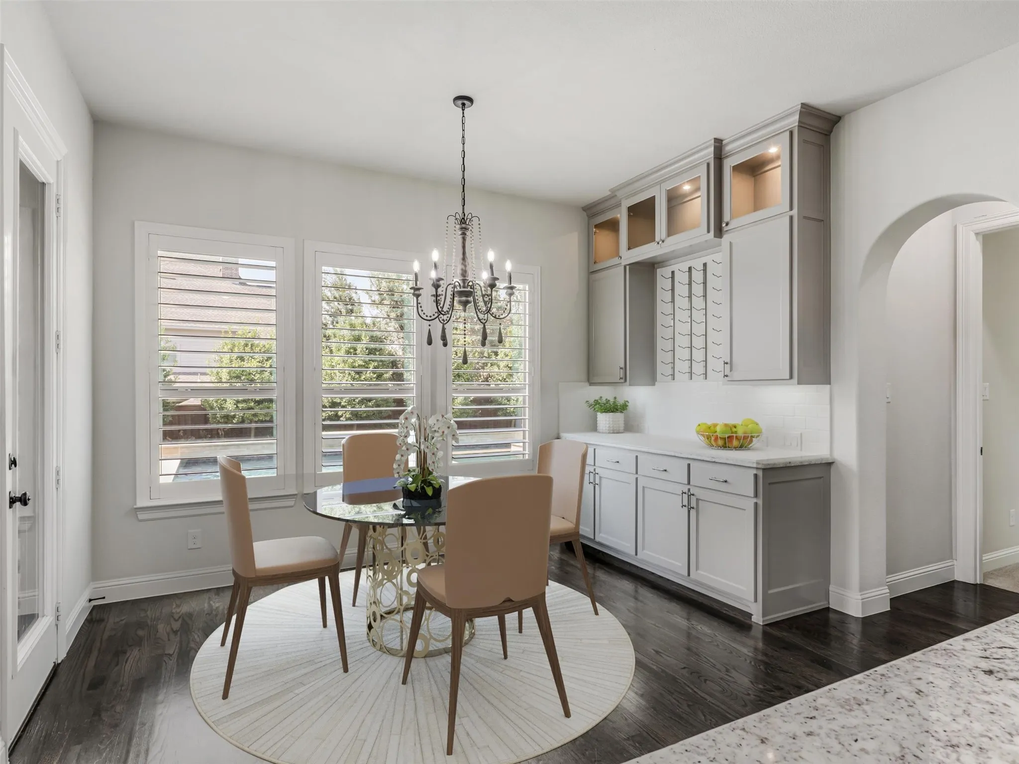 VIRTUALLY STAGED. An adjoining breakfast nook provides a casual dining area with convenient access to the patio and outdoor living spaces.