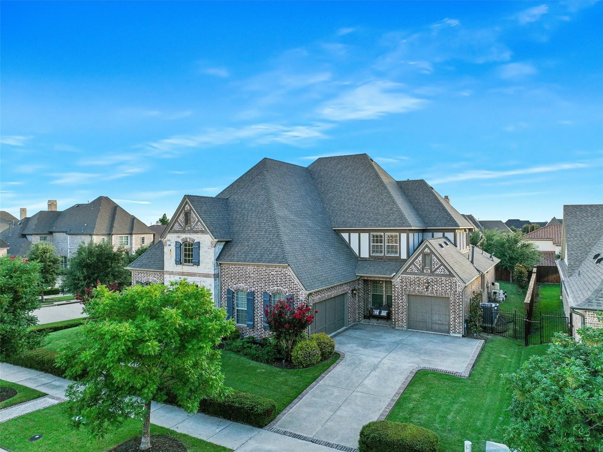 The landscaping has also been thoughtfully enhanced with mature plantings, including five holly trees, five magnolia trees, and a mature oak tree. A wrought iron fence, refinished in 2024, complements the grounds and outdoor living environment.