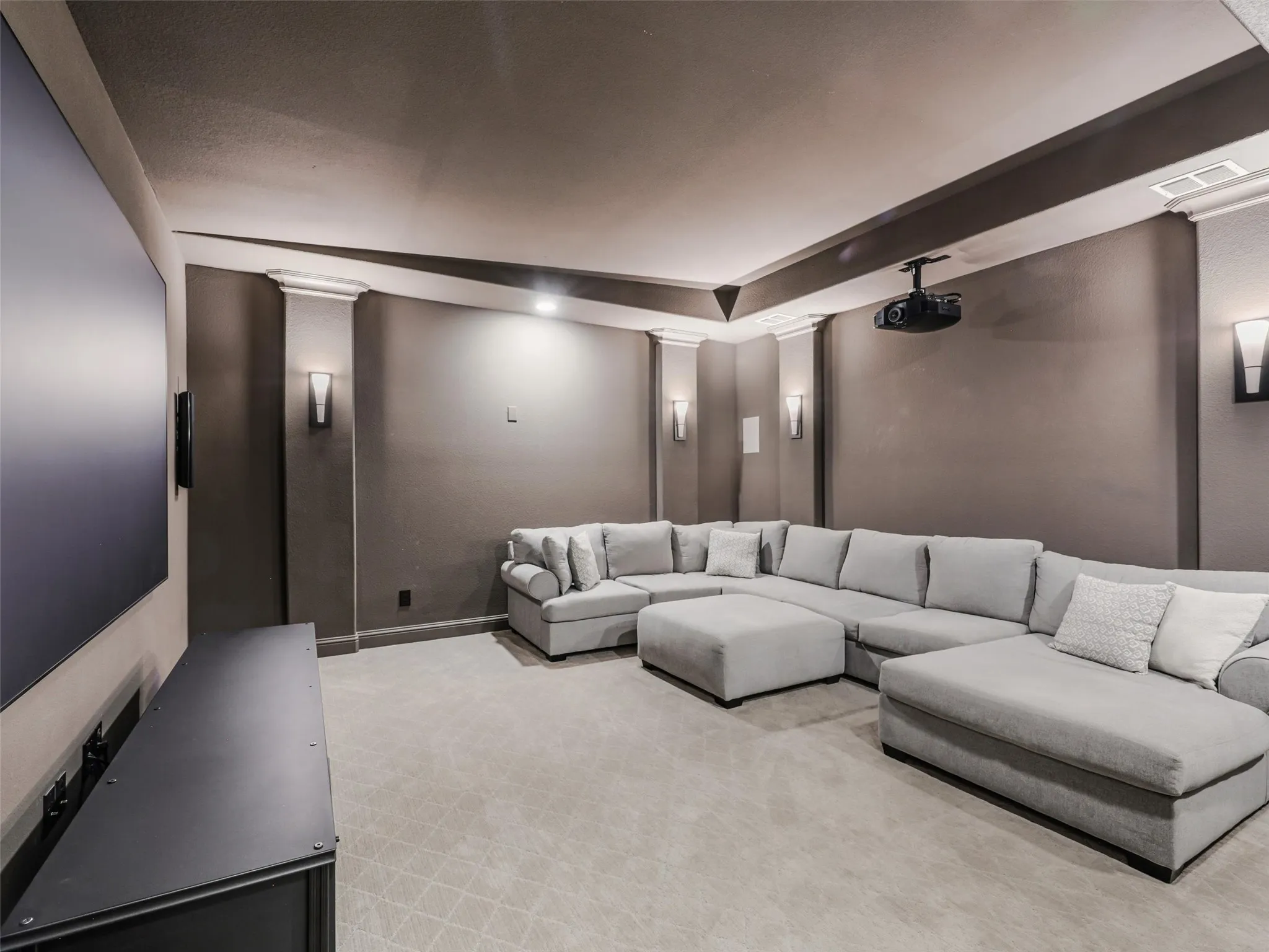 DOWN-STAIRS-MEDIA.  Majorly sought after floor plan.  GUEST and MEDIA DOWN.  Oversized GARAGE SPACES. The home's entertainment spaces continue with a dedicated media room featuring sconce lighting and a substantial 6-by-4-foot wet bar. Whether hosting movie nights, sporting events, or gatherings with friends, this flexible space provides another destination for entertaining without leaving home.