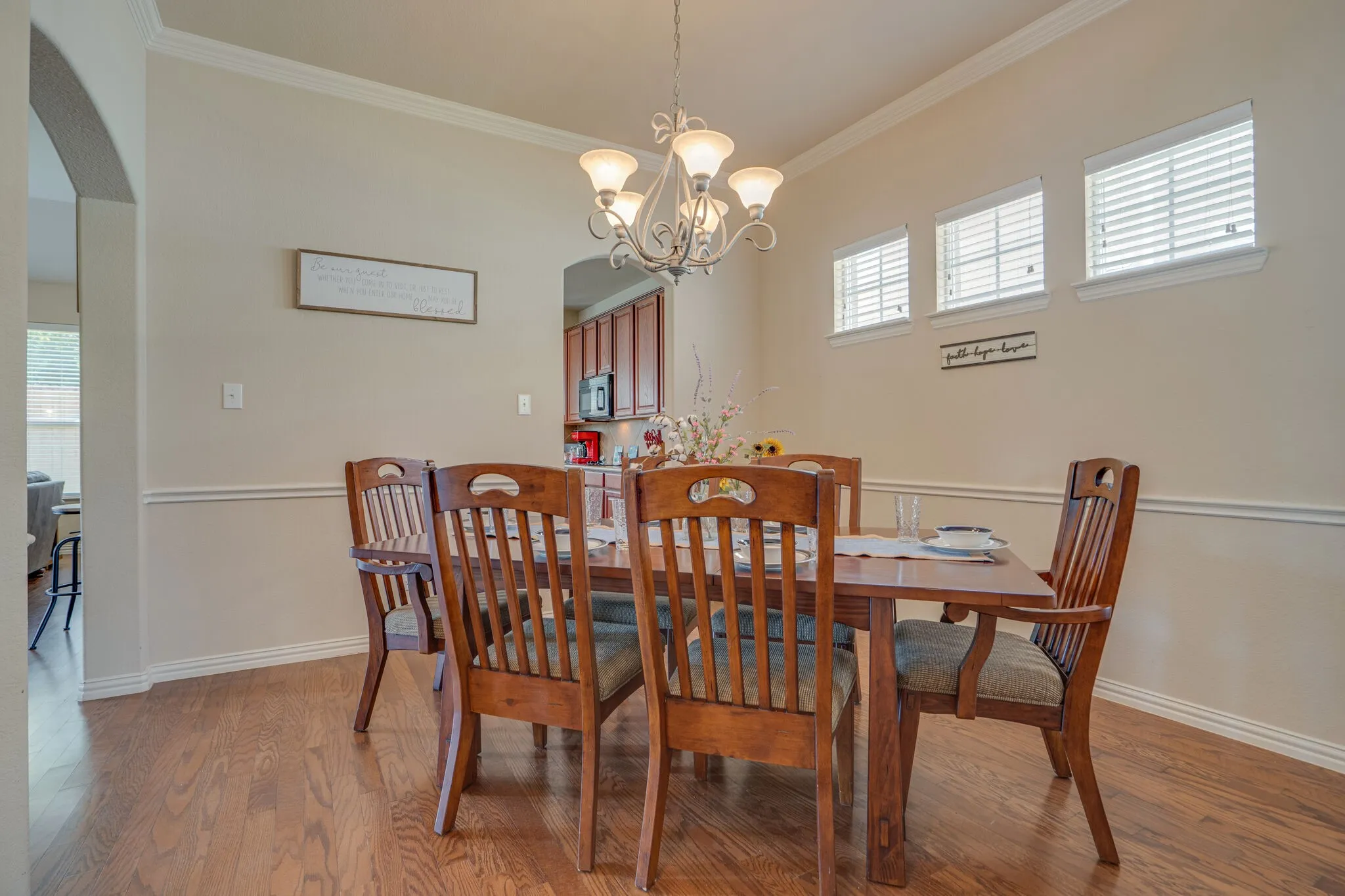 Hardwood-finish flooring with crown molding and chair rail detailing