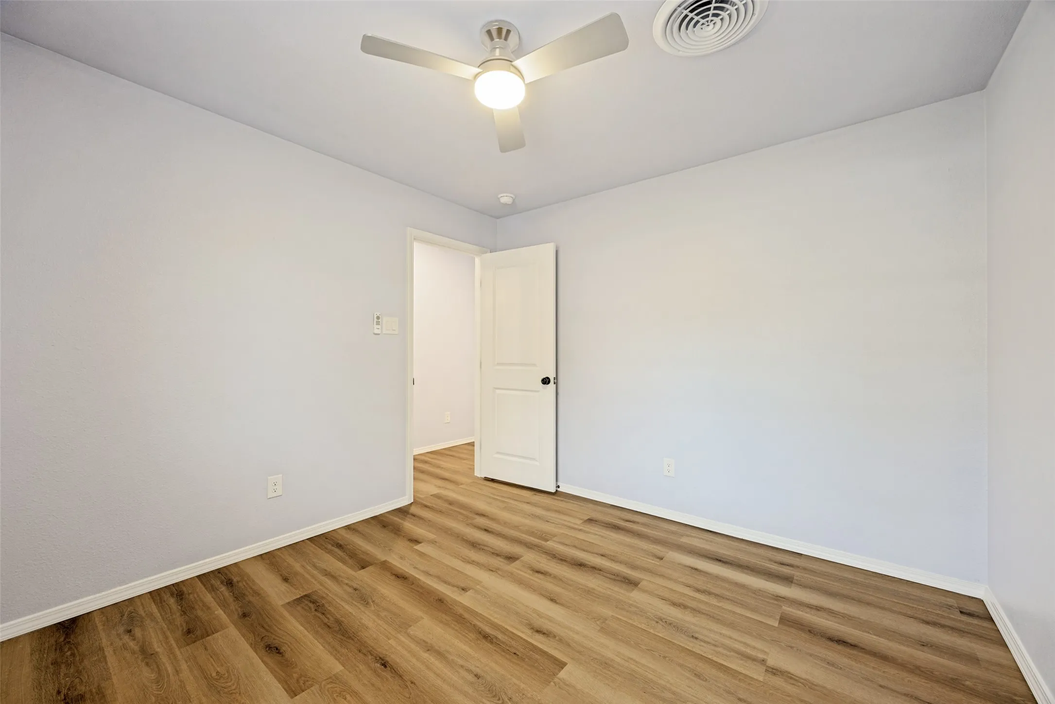 Wood-finish flooring with light-toned walls