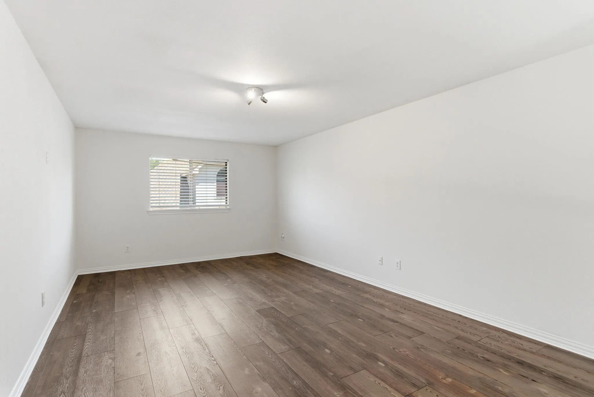 Neutral wall finishes and wood-finish flooring