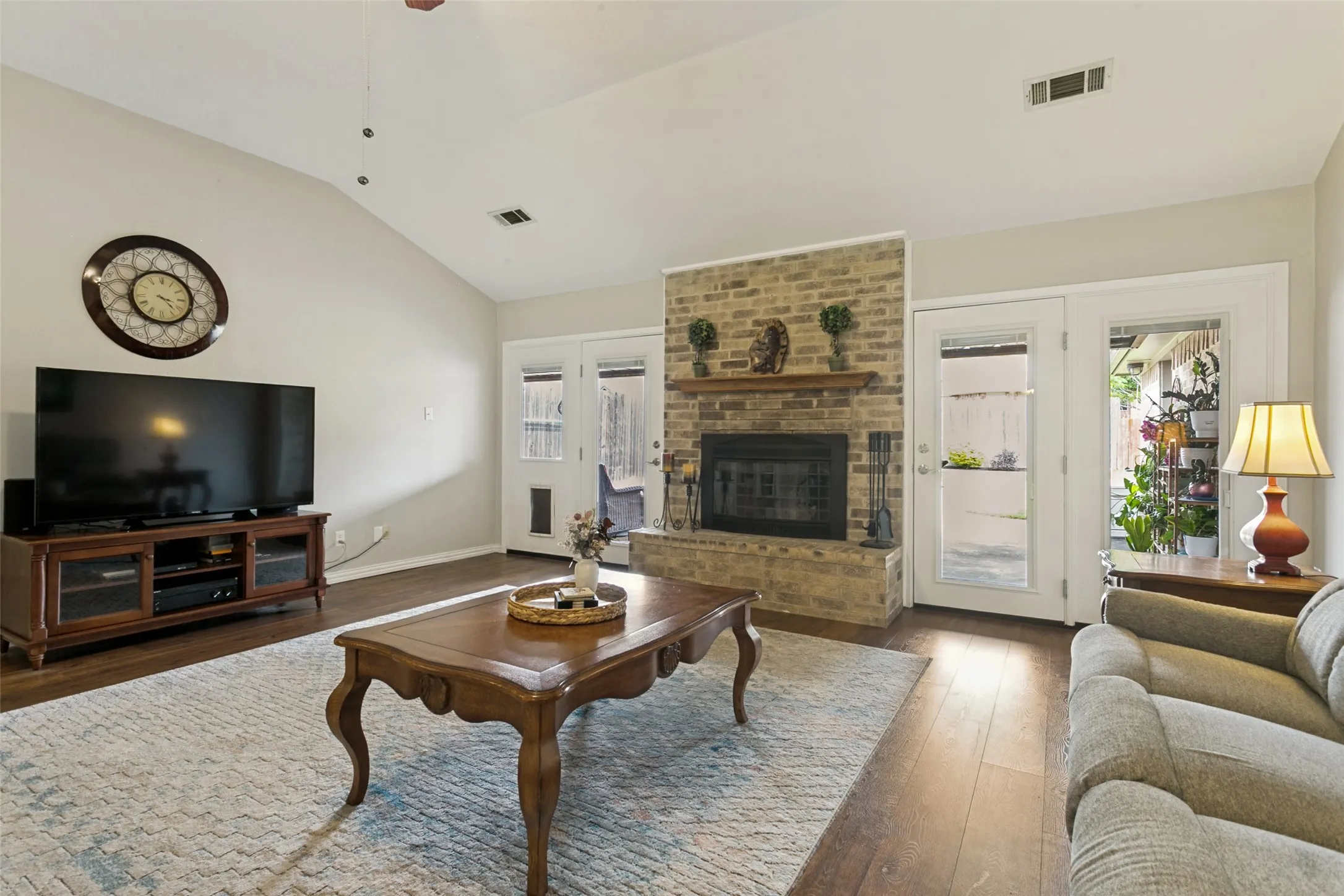 Vaulted ceiling accentuates the wood-finish flooring