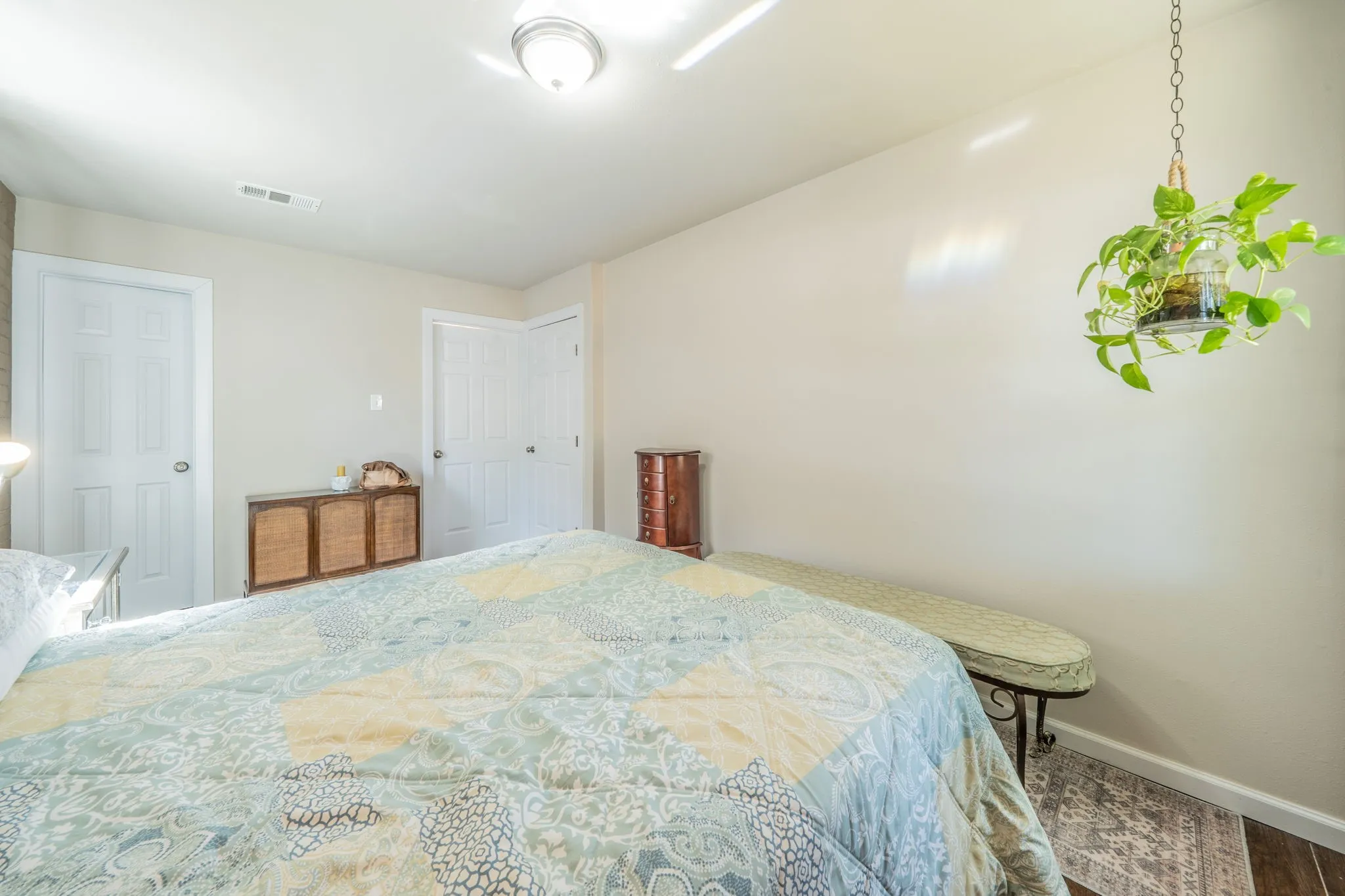 White paneled doors, ceiling-mounted light fixture