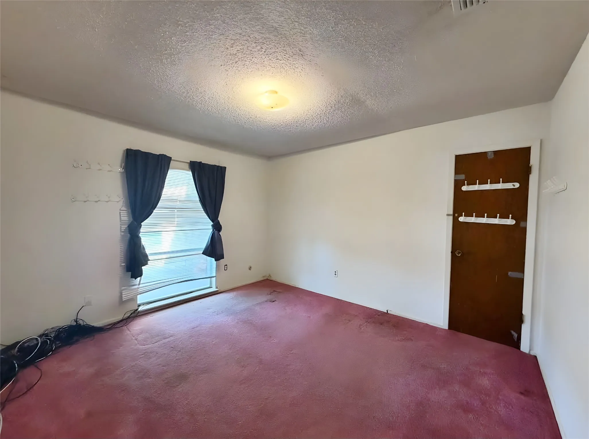 A 12' 6" x 11'2" bedroom offers enough space to comfortably serve as either a bedroom or a nice study.