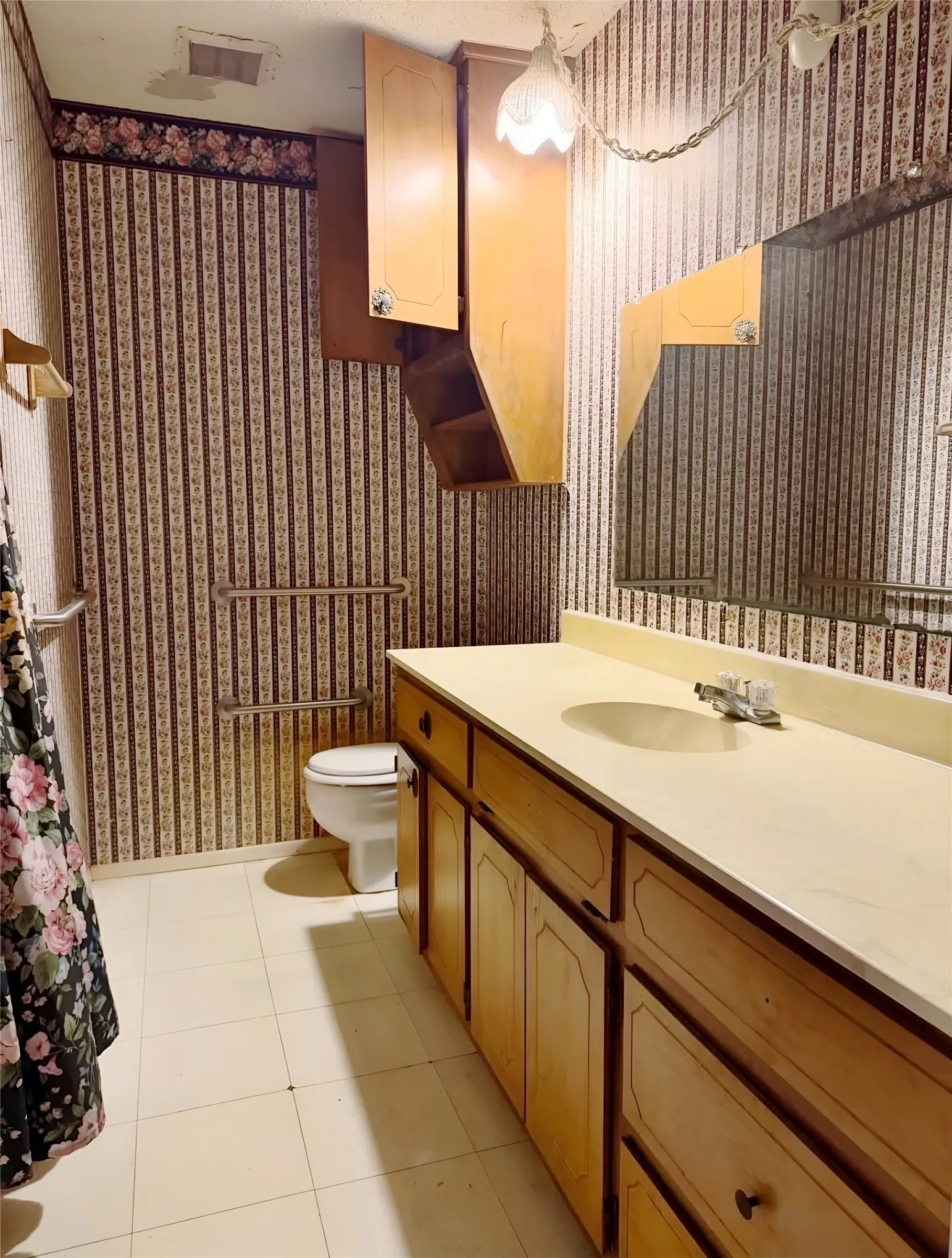 Generous full bathroom with ample counter space and convenient access to the bedrooms.