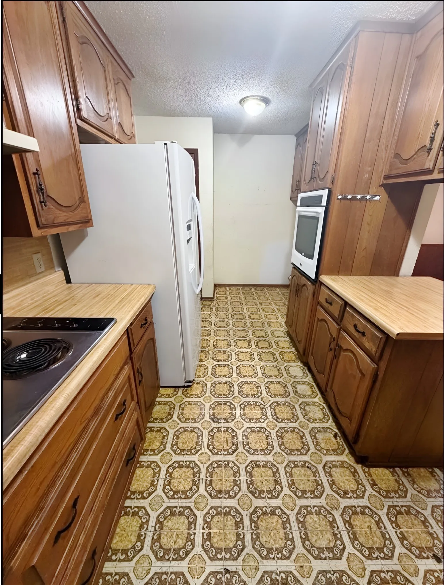 Multi-purpose utility space off of the kitchen for a all-in-one kitchen, laundry and pantry area