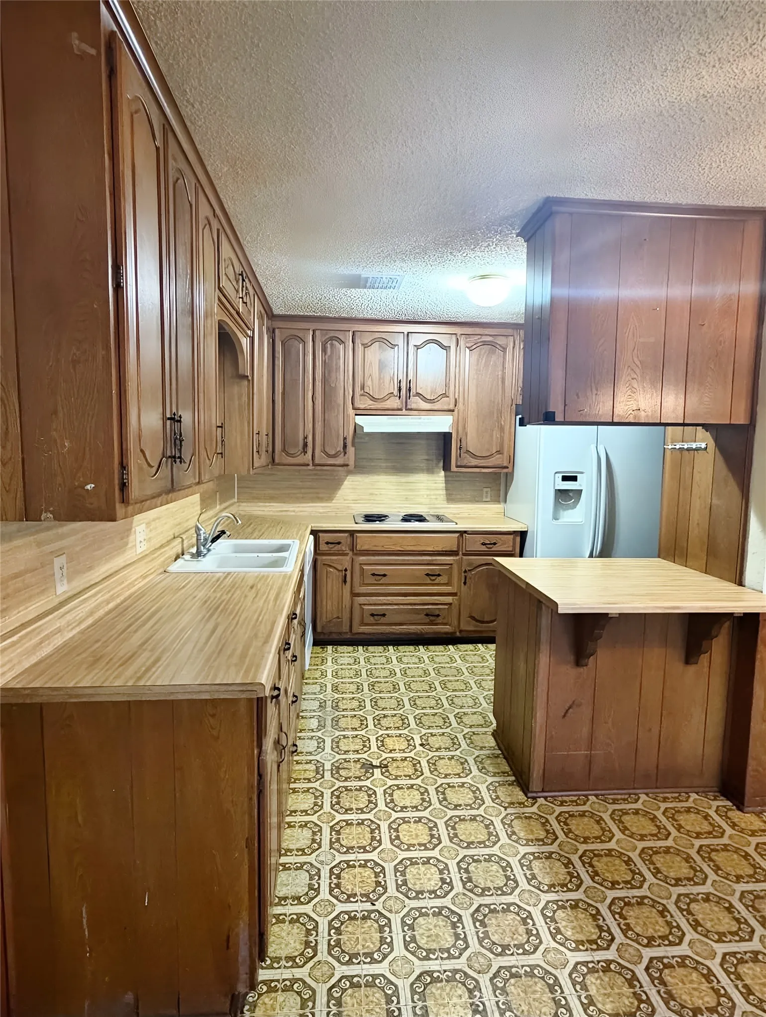 Kitchen has an abundance of cabinets - plenty of storage space for dishes, cookware and other items.
