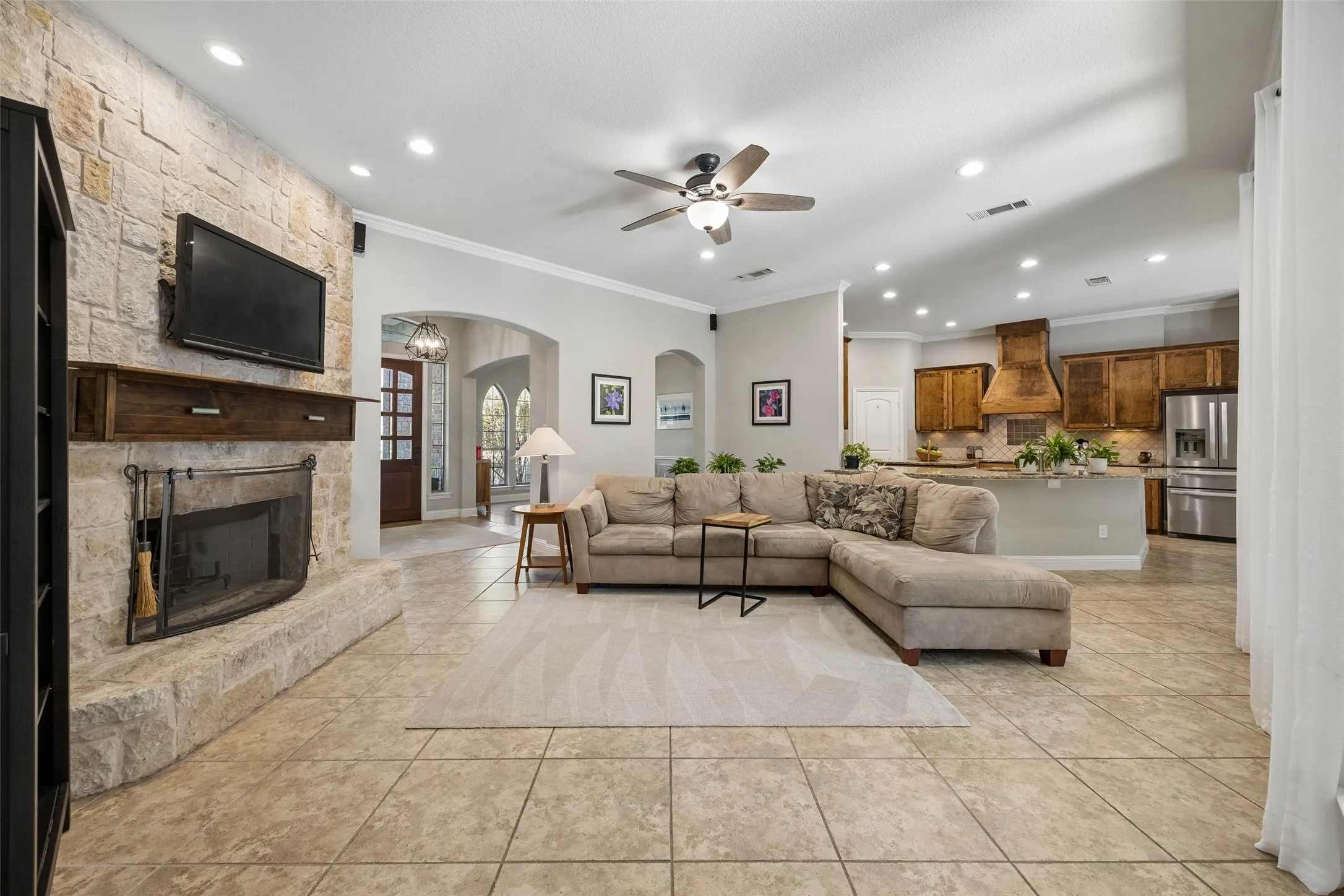 Austin Stone woodburning fireplace anchors the living room