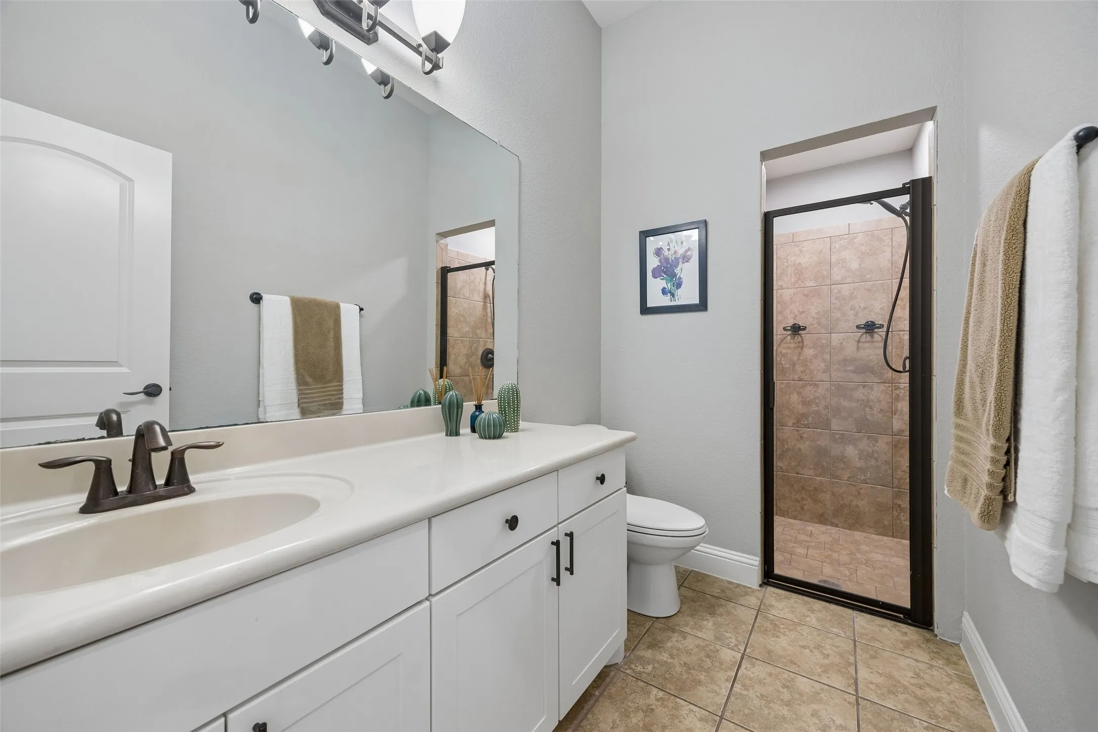 Full bathroom adjacent to office and direct access to patio