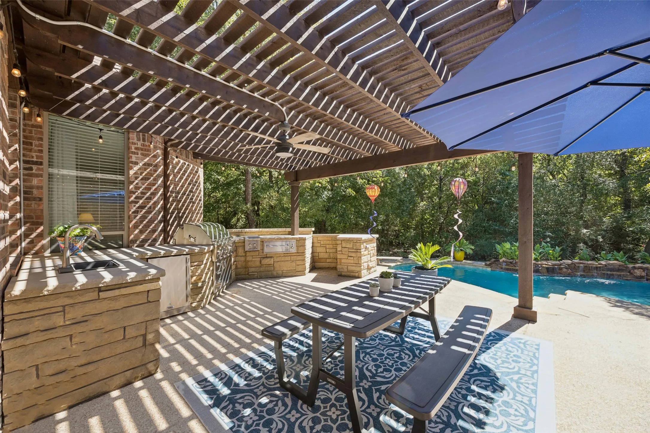Custom Outdoor Kitchen fully equipped with Lynx grill,cooktop,warming drawer, fridge, sink, space for a smoker