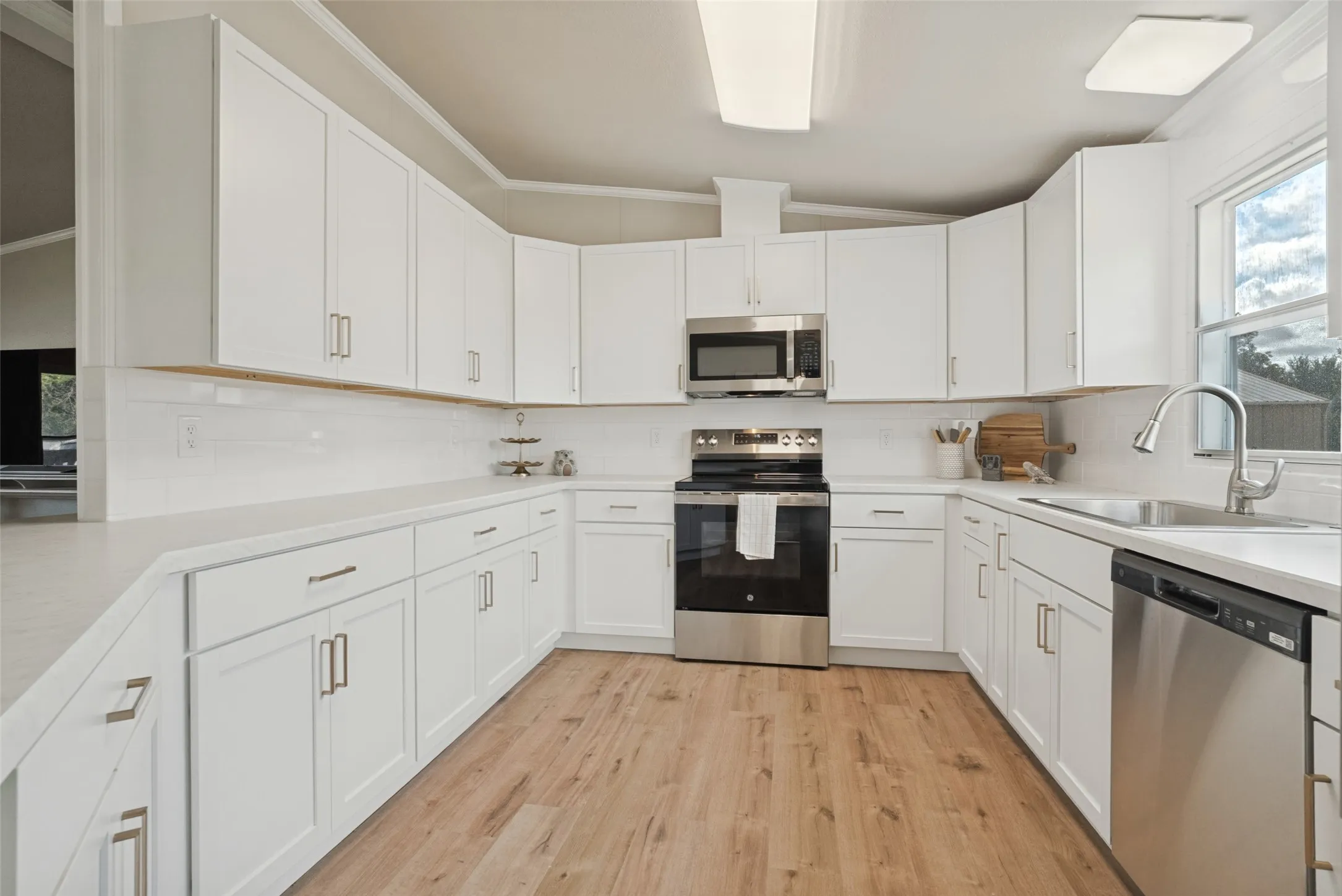 Kitchen with white cabinets and stainless appliances
