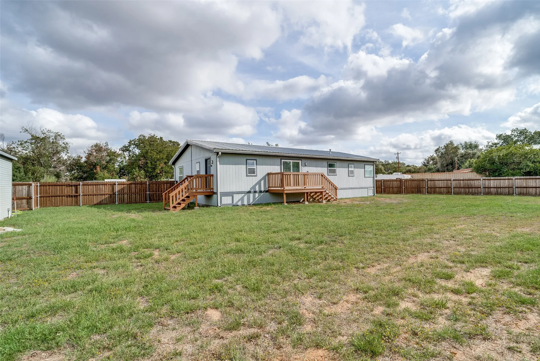 Back of the home with deck