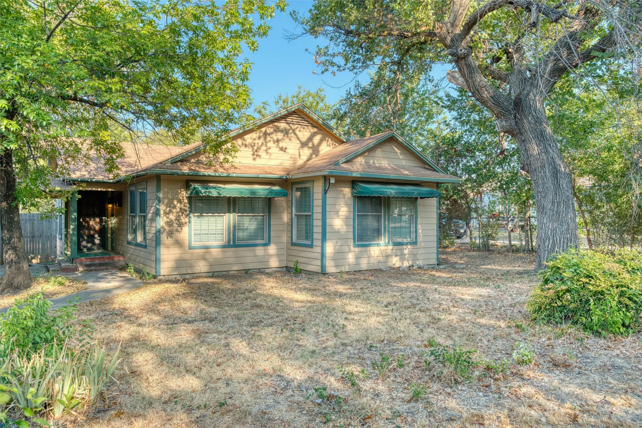 Front exterior with mature oak