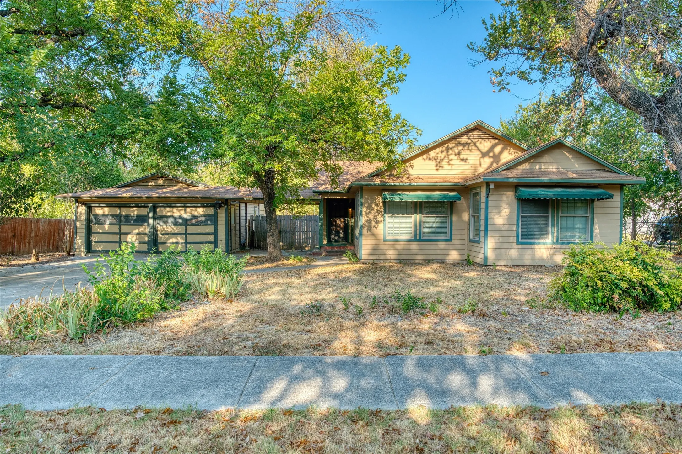 Front of the home on a tree-shaded lot