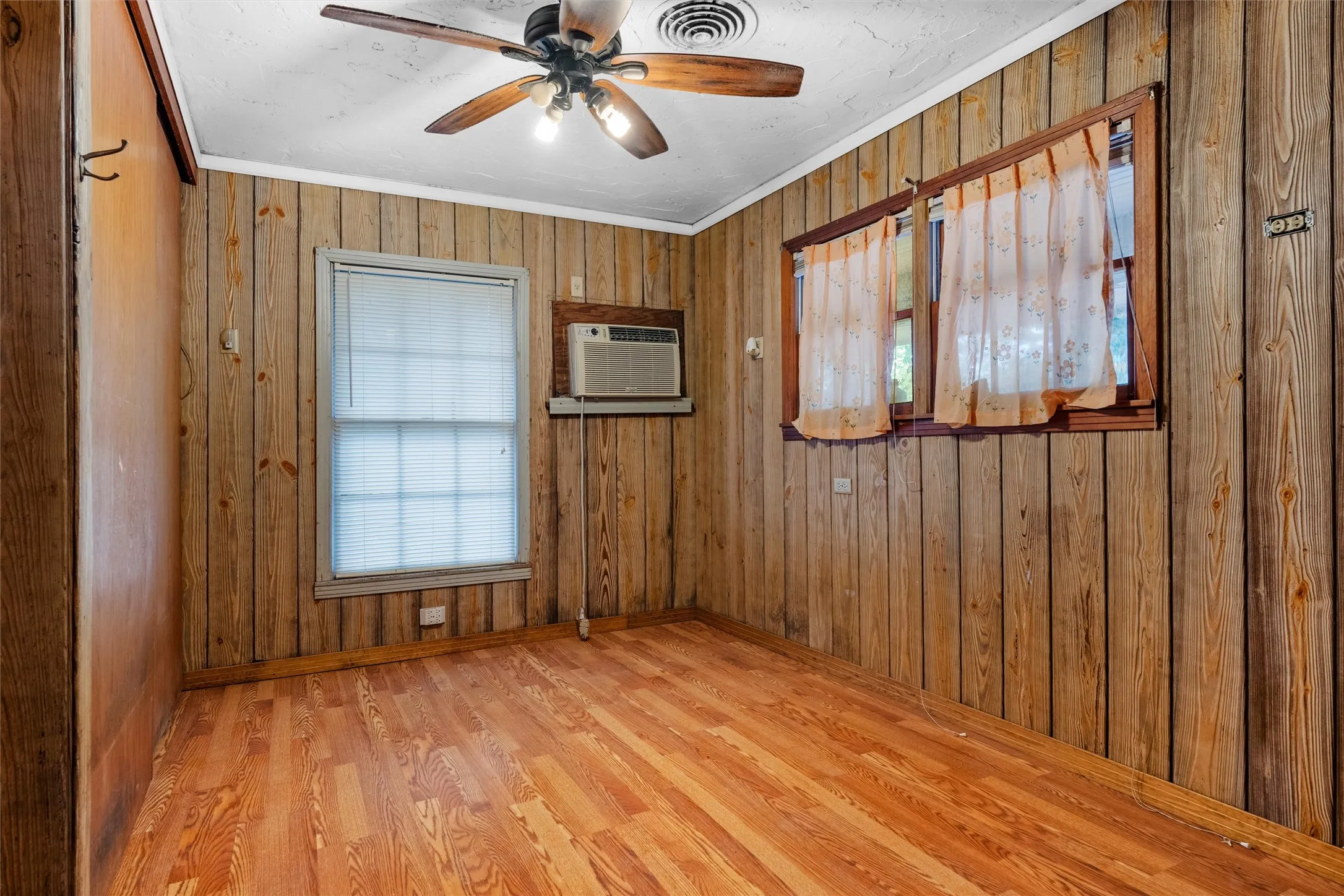 Bedroom 3 with wood paneling