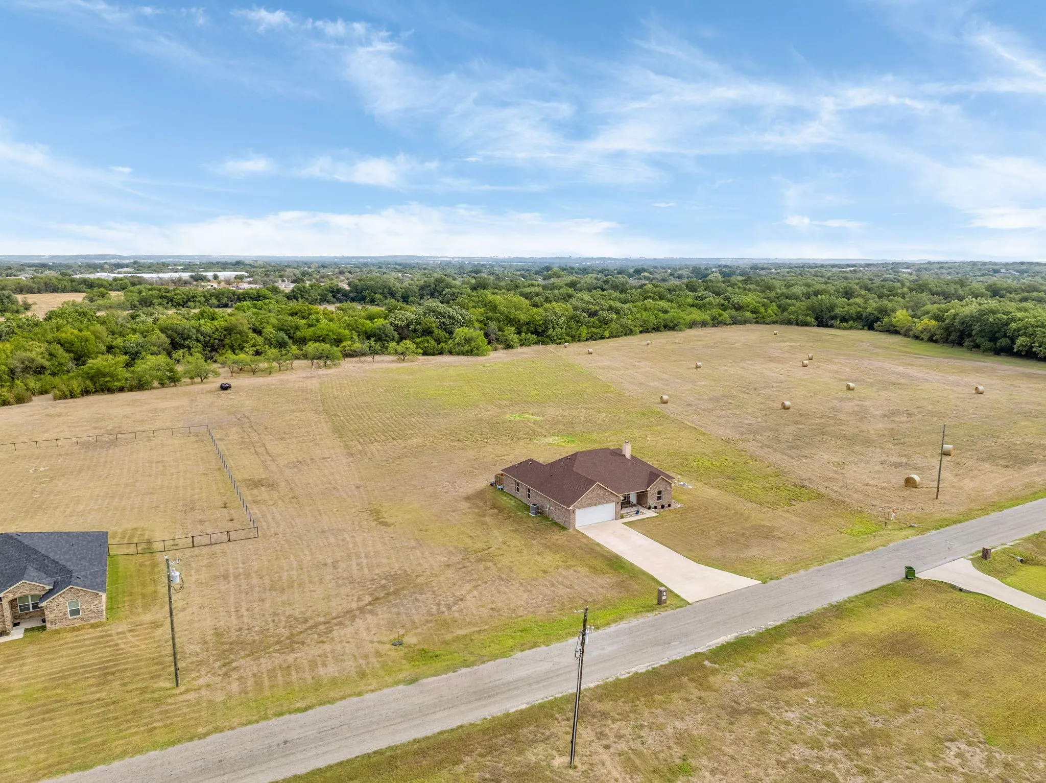 Drone view of home and acreage